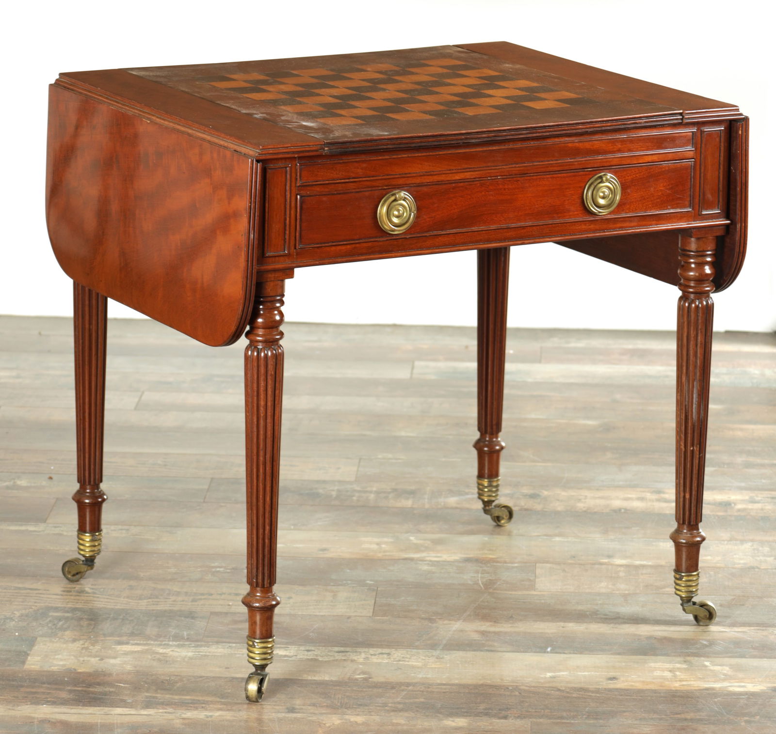 A GOOD REGENCY FIGURED MAHOGANY GAMES TABLE IN THE MANNER OF GILLOWS OF LANCASTER (1 of 10)