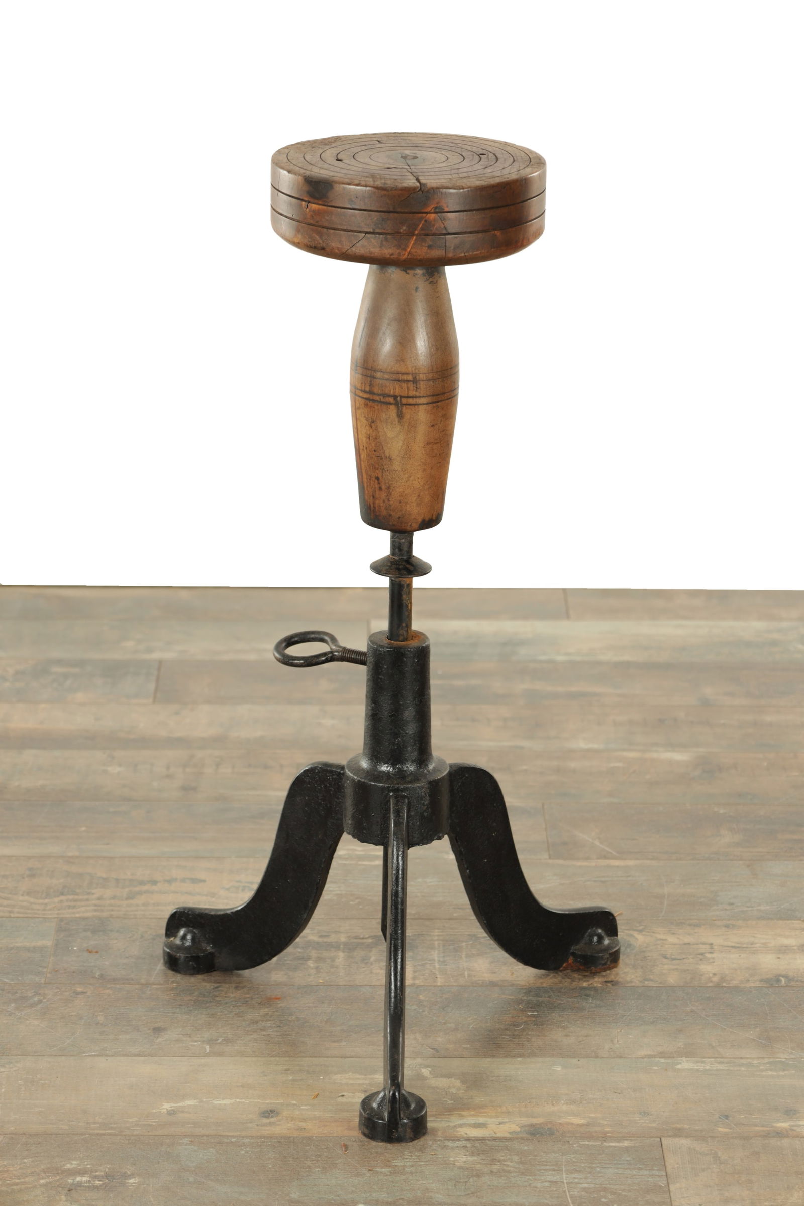 A LATE 19TH CENTURY ADJUSTABLE GUILDERS STOOL/WORK TABLE: A LATE 19TH CENTURY ADJUSTABLE GUILDERS STOOL/WORK TABLE with a cast iron and a turned wood adjustable gilders stool. (67cm high and seat diameter of 22cm)