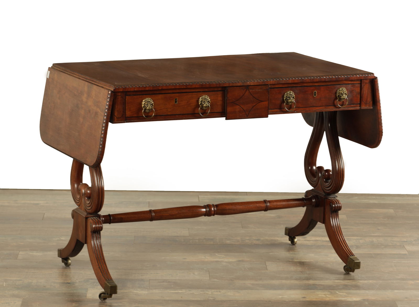 A REGENCY MAHOGANY SOFA TABLE WITH EBONY INLAID DECORATION (1 of 6)
