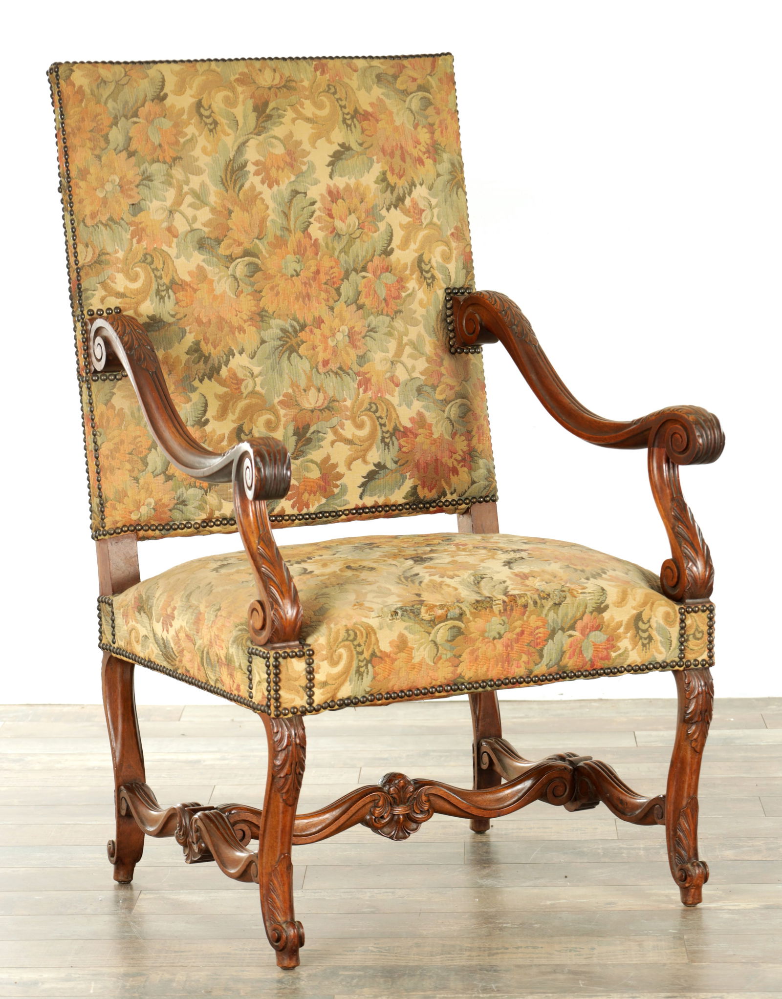 A 19TH CENTURY FRENCH CARVED WALNUT AND UPHOLSTERED ARMCHAIR (1 of 9)