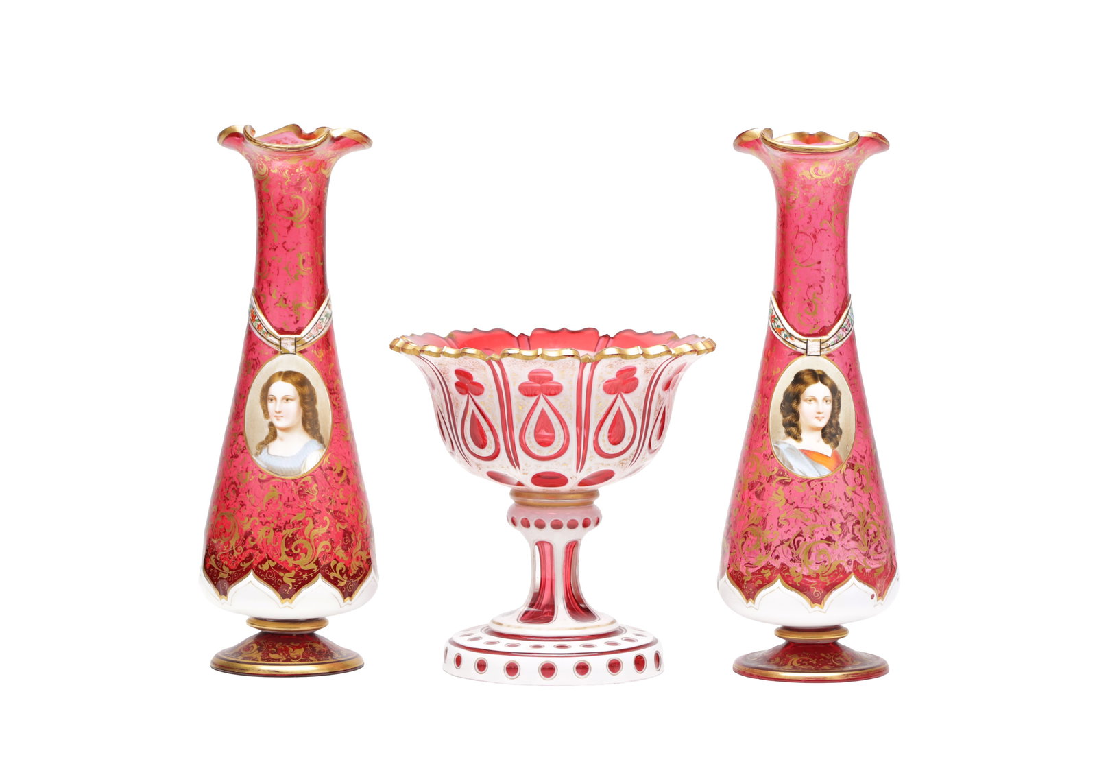 THREE LATE 19TH CENTURY BOHEMIAN RUBY CUT TO OPALINE AND GILT GLASS PIECES: THREE LATE 19TH CENTURY BOHEMIAN RUBY CUT TO OPALINE AND GILT GLASS PIECES comprising a pair of tapering trumpet vases each with an oval portrait medallion and foliate gilt scrollwork, and a pedestal