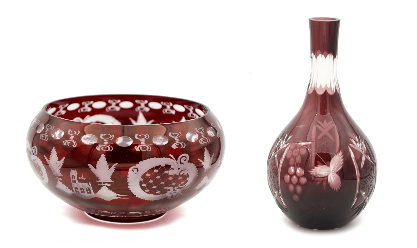 TWO LATE 19TH/EARLY 20TH CENTURY BOHEMIAN RUBY OVERLAY CUT GLASS BOWL AND DECANTER: TWO LATE 19TH/EARLY 20TH CENTURY BOHEMIAN RUBY OVERLAY CUT GLASS BOWL AND DECANTER each with wheel-engraved foliate and berry decoration, the bowl of rounded form, the decanter of pear-shaped body wit