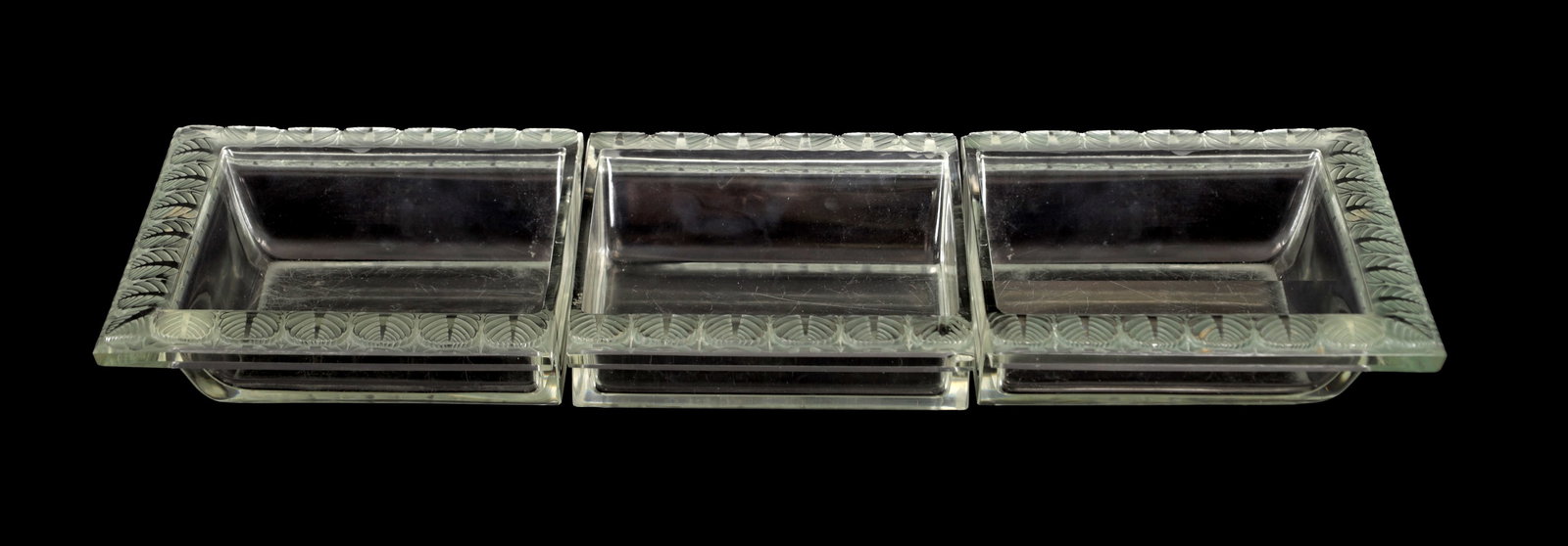 RENE LALIQUE A FRENCH FROSTED AND CLEAR GLASS 'CHARME' THREE-SECTION JARDINIERE CENTREPIECE: RENE LALIQUE A FRENCH FROSTED AND CLEAR GLASS 'CHARME' THREE-SECTION JARDINIERE CENTREPIECE of rectangular form with three square compartments and a broad moulded rim with leaf decoration, the central