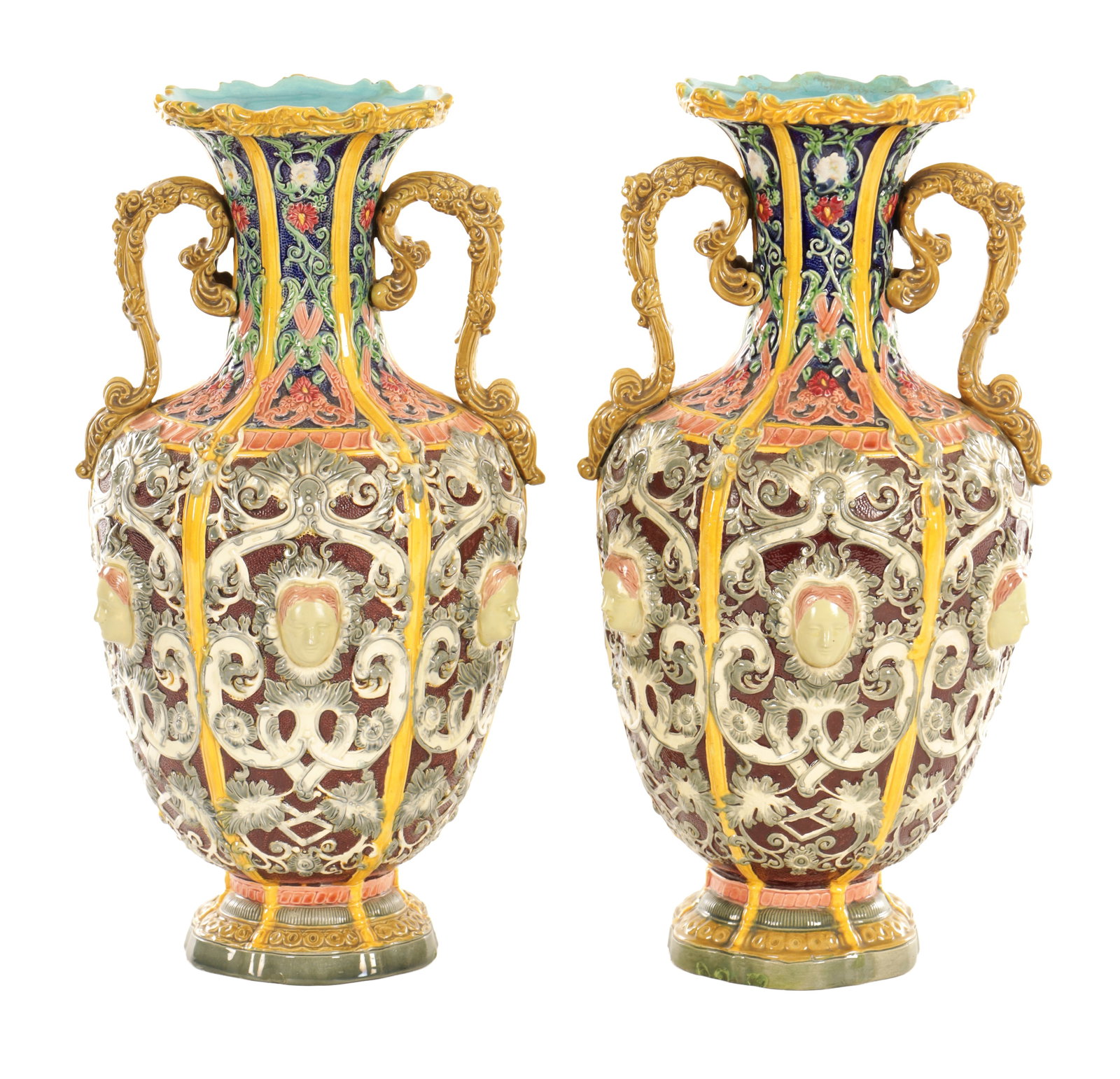 A PAIR OF LATE 19TH CENTURY COPELAND RENAISSANCE REVIVAL MAJOLICA VASES: A PAIR OF LATE 19TH CENTURY COPELAND RENAISSANCE REVIVAL MAJOLICA VASES each of baluster form with flared rim, twin scroll handles and moulded classical masks to the body, decorated in richly coloured