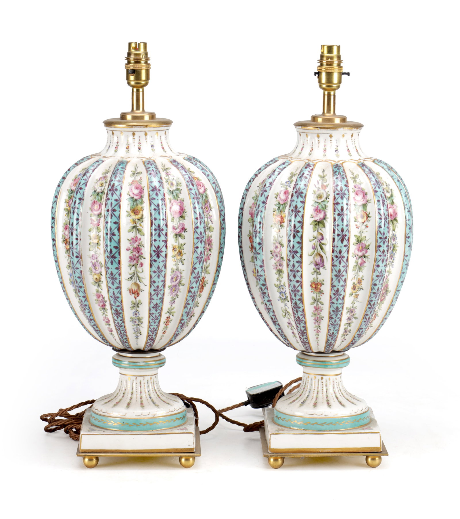 A PAIR OF 20TH CENTURY SEVRES STYLE PORCELAIN ELECTRIC TABLE LAMPS: A PAIR OF 20TH CENTURY SEVRES STYLE PORCELAIN ELECTRIC TABLE LAMPS of lobed ovoid form with vertical panels painted with flower sprays alternating with turquoise trellis bands with gilt highlights, fi