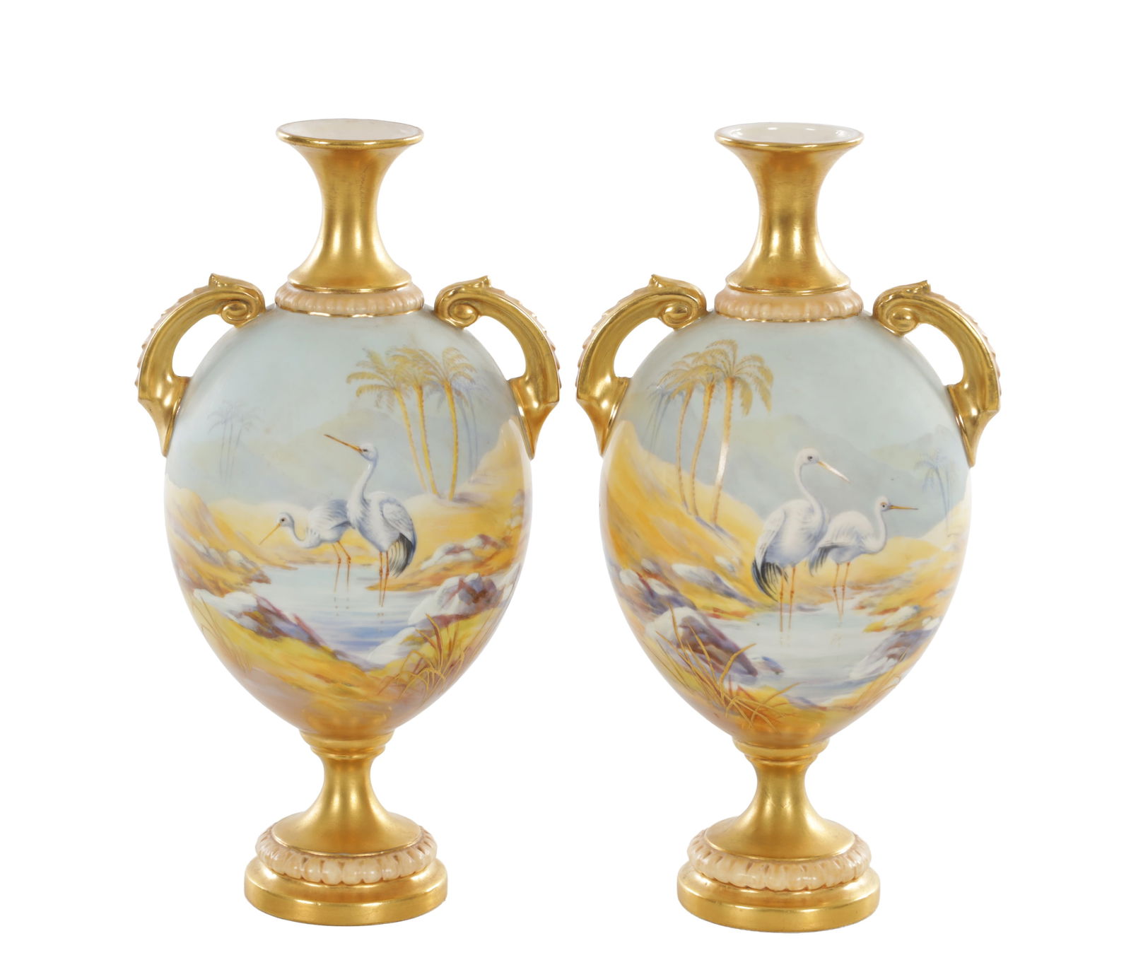 A FINE PAIR OF EARLY 20TH CENTURY ROYAL WORCESTER PORCELAIN TWIN-HANDLED CABINET VASES BY JOHNSON: A FINE PAIR OF EARLY 20TH CENTURY ROYAL WORCESTER PORCELAIN TWIN-HANDLED CABINET VASES BY JOHNSON each of ovoid form with a flared neck and twin scroll handles, finely hand painted with storks standin