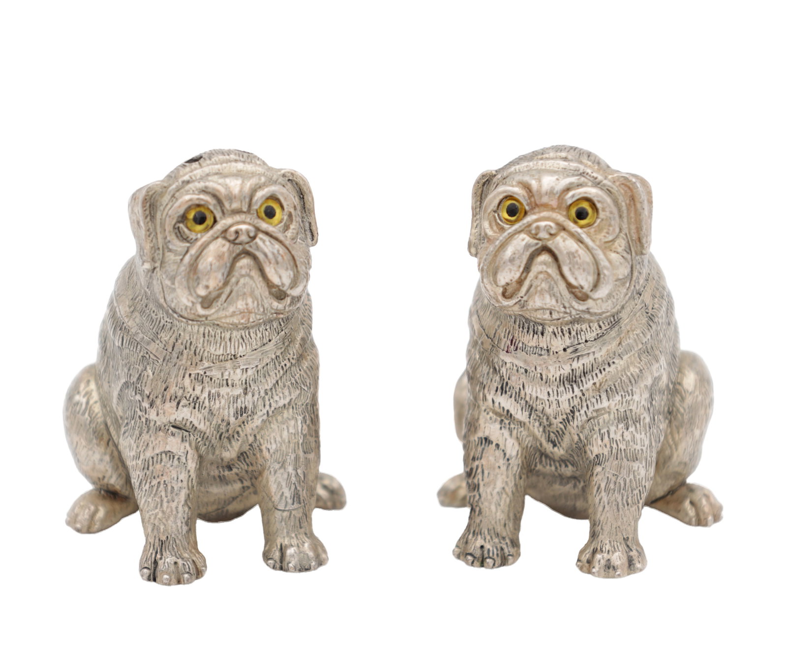 A PAIR OF CONTINENTAL SILVER SALT AND PEPPER SHAKERS: A PAIR OF CONTINENTAL SILVER SALT AND PEPPER SHAKERS modelled as pugs with yellow and black glass eyes, both hallmarked '800 '. Total weight app. 111.3g. (Height 5cm )