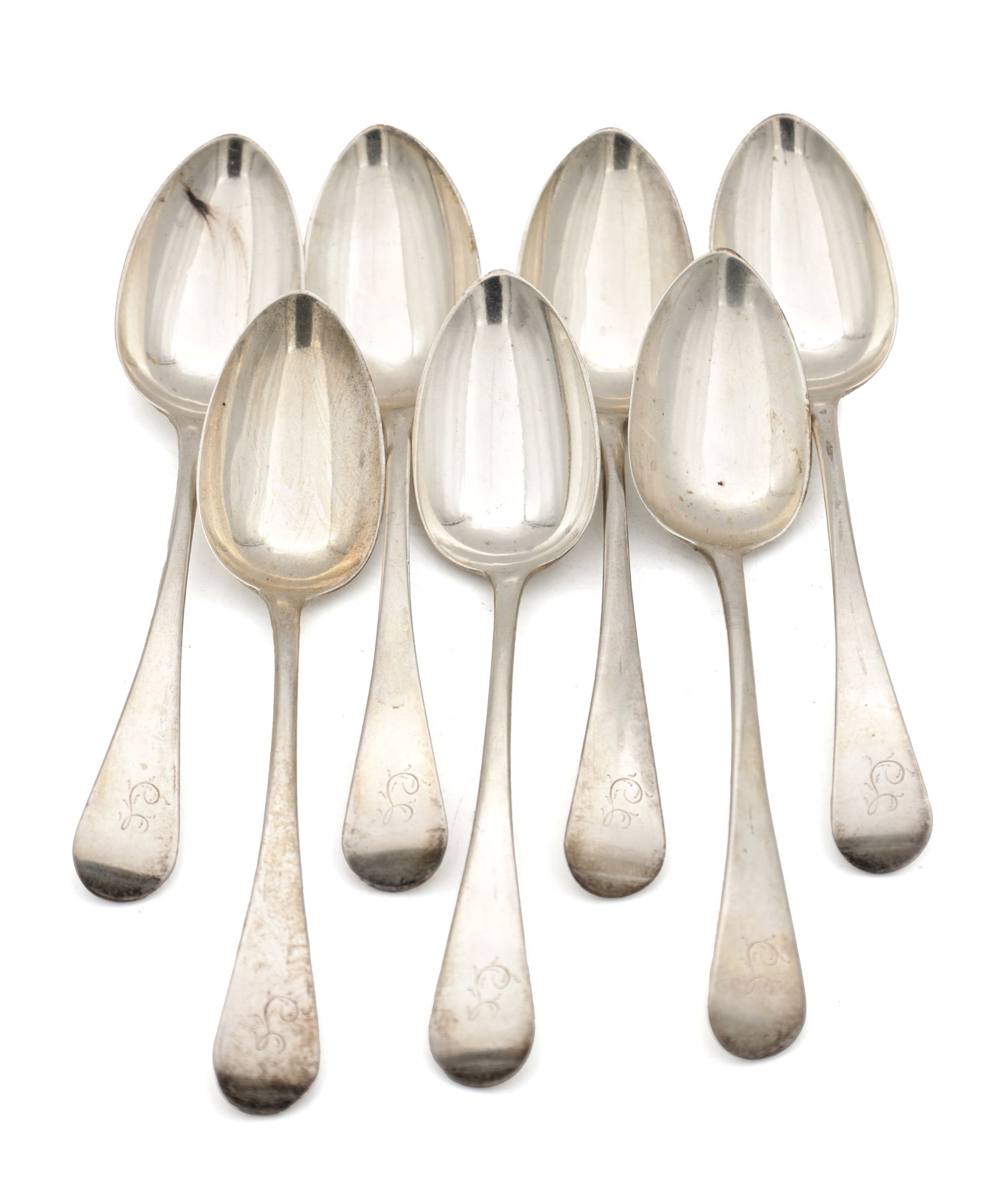 A SET OF SEVEN GEORGIAN SILVER TABLE SPOONS: A SET OF SEVEN GEORGIAN SILVER TABLE SPOONS hallmarked London 1811 by Mary & Eliza Sumner, each with an engraved script initial to the terminal, total weight approx. 250g. (Lengths 17.5cm )