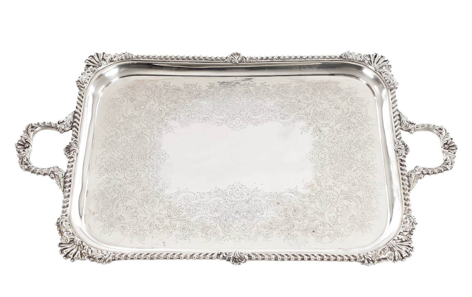 A LARGE EDWARDIAN ENGLISH SILVER TWIN-HANDLED TRAY: A LARGE EDWARDIAN ENGLISH SILVER TWIN-HANDLED TRAY of rectangular form with rounded corners, the surface finely engraved with scrolling foliate decoration and floral motifs within a shaped border, the
