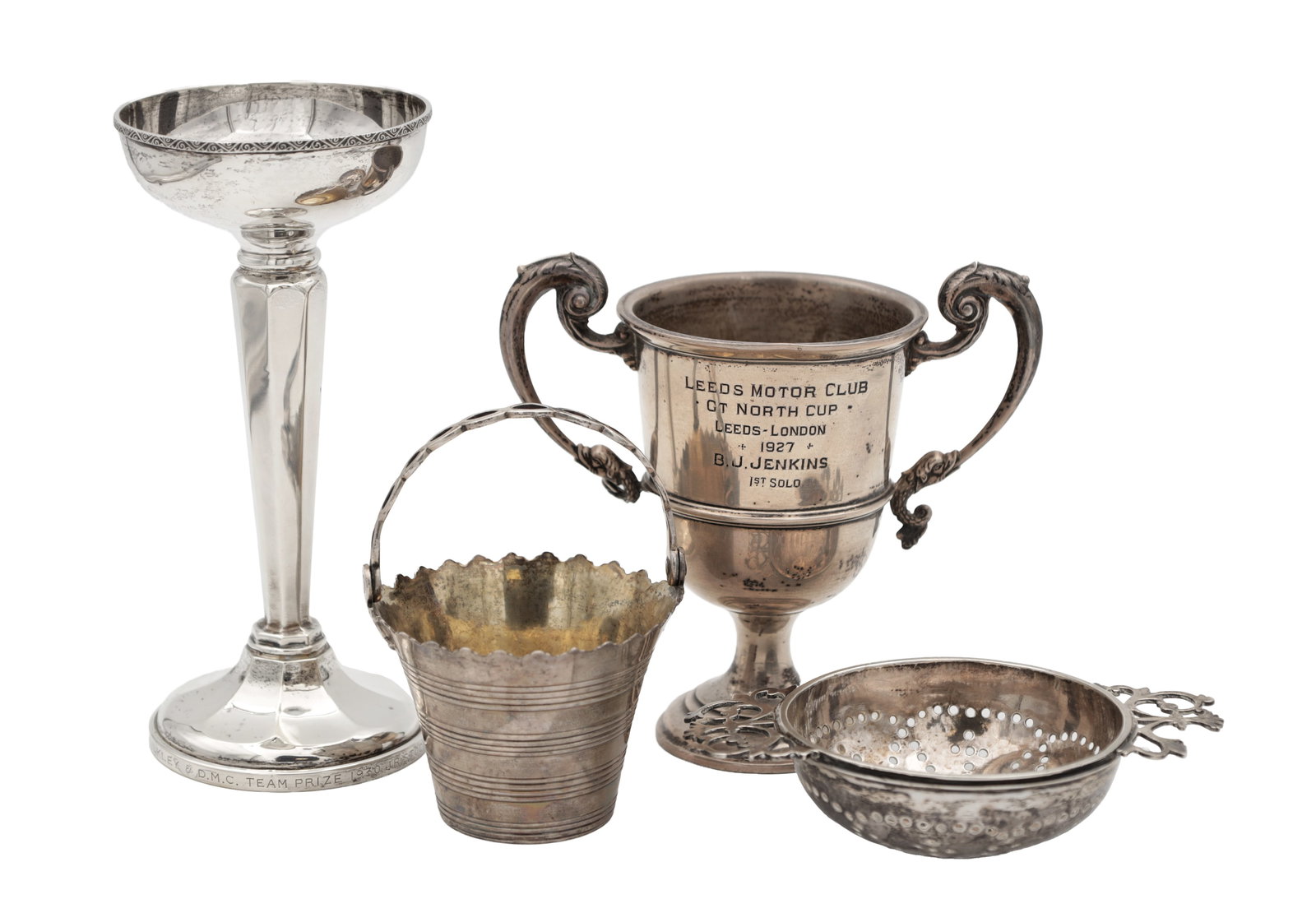 A COLLECTION OF 18TH-20TH CENTURY SILVER ITEMS: A COLLECTION OF 18TH-20TH CENTURY SILVER ITEMS comprising a silver sieve hallmarked London 1720, a silver candlestick with a wood-filled base, hallmarked Birmingham 1930, a silver novelty basket hallm