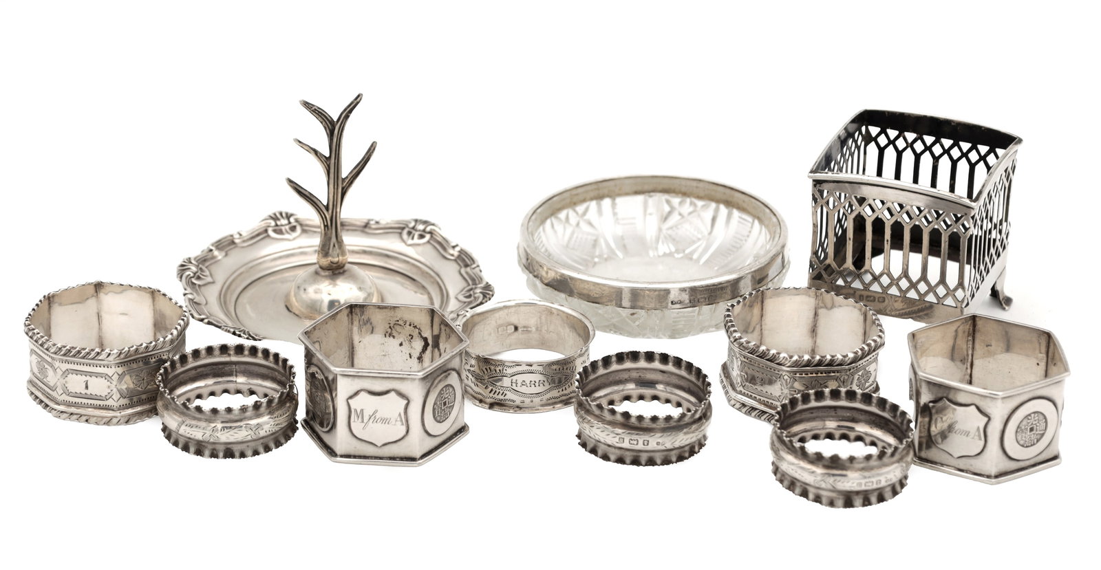 A COLLECTION OF 19TH/20TH CENTURY SILVER ITEMS: A COLLECTION OF 19TH/20TH CENTURY SILVER ITEMS comprising assorted silver napkin rings with bright-cut and beaded decoration together with a silver-mounted cut glass bowl, a small ring stand and a pie