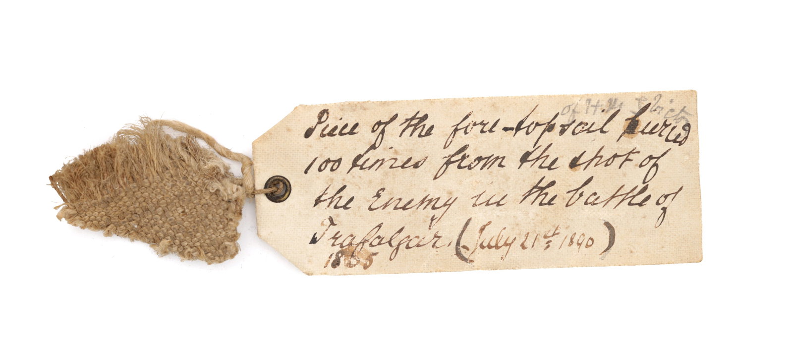 AN EARLY 19TH CENTURY PIECE OF SAIL CLOTH FROM THE BATTLE OF TRAFALGAR: AN EARLY 19TH CENTURY PIECE OF SAIL CLOTH FROM THE BATTLE OF TRAFALGAR of Nelson interest, with an old attached note inscribed "Piece of the fore-top sail pierced 100 times from the shot of the Enemy
