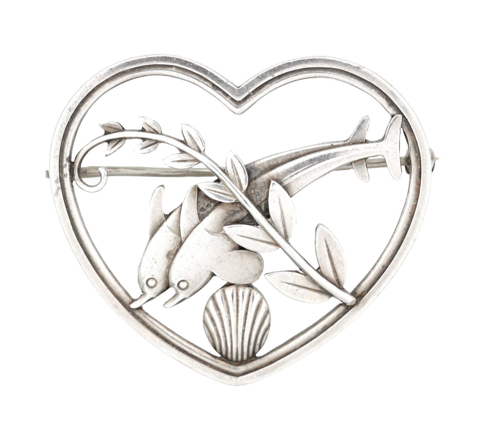ARNO MALINOWSKI FOR GEORG JENSEN A STERLING SILVER DOLPHIN BROOCH: ARNO MALINOWSKI FOR GEORG JENSEN A STERLING SILVER DOLPHIN BROOCH of open heart form pierced with two dolphins before a leafy branch and scallop shell, stamped Georg Jensen makers mark and STERLING DE
