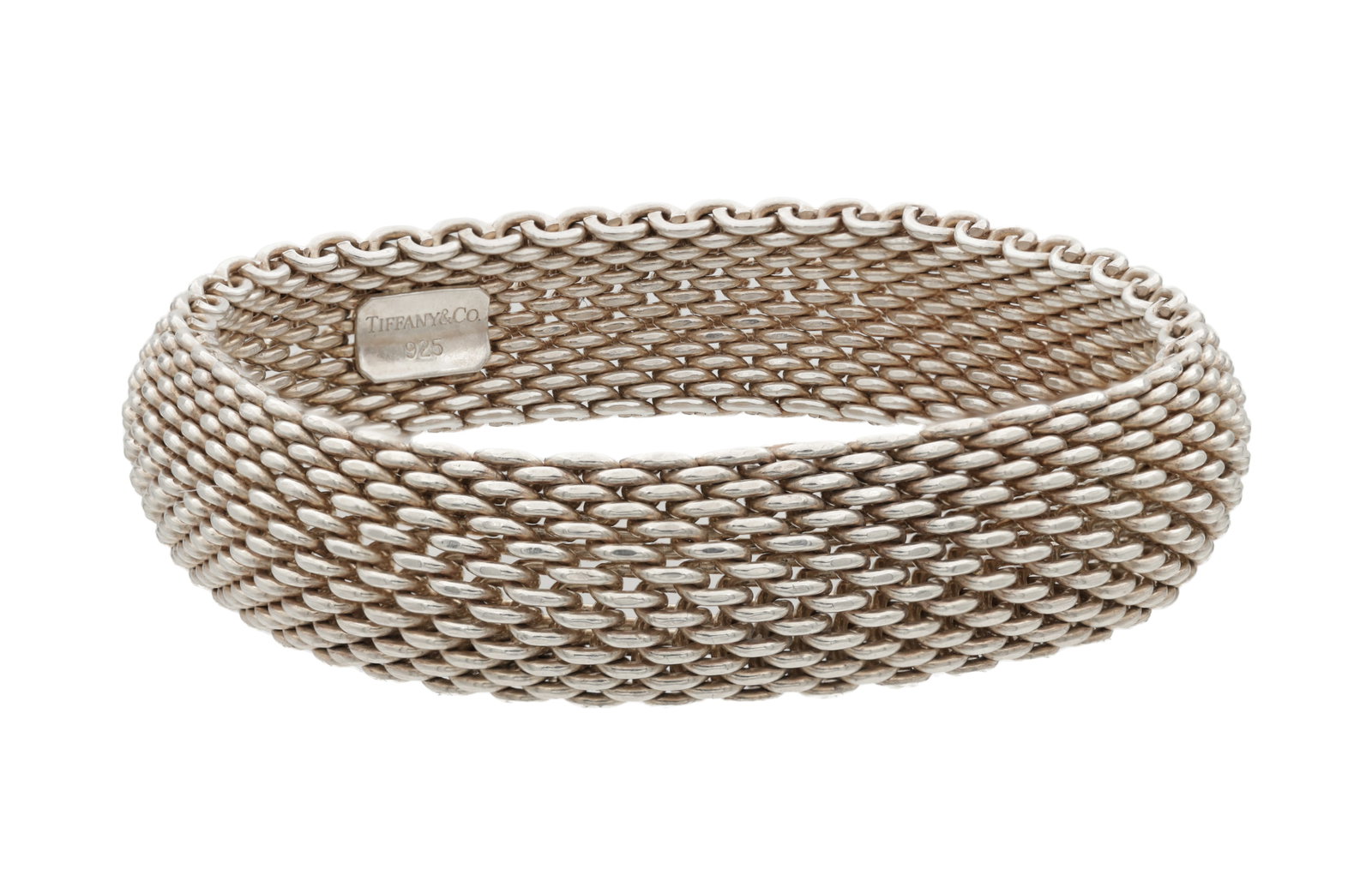 A TIFFANY & CO STERLING SILVER SOMERSET WIDE MESH BRACELET: A TIFFANY & CO STERLING SILVER SOMERSET WIDE MESH BRACELET marked 925 and Tiffany & Co to the interior, of flexible woven mesh design, with a Tiffany box, total app. weight 55.9g. (Length 18.8cm)