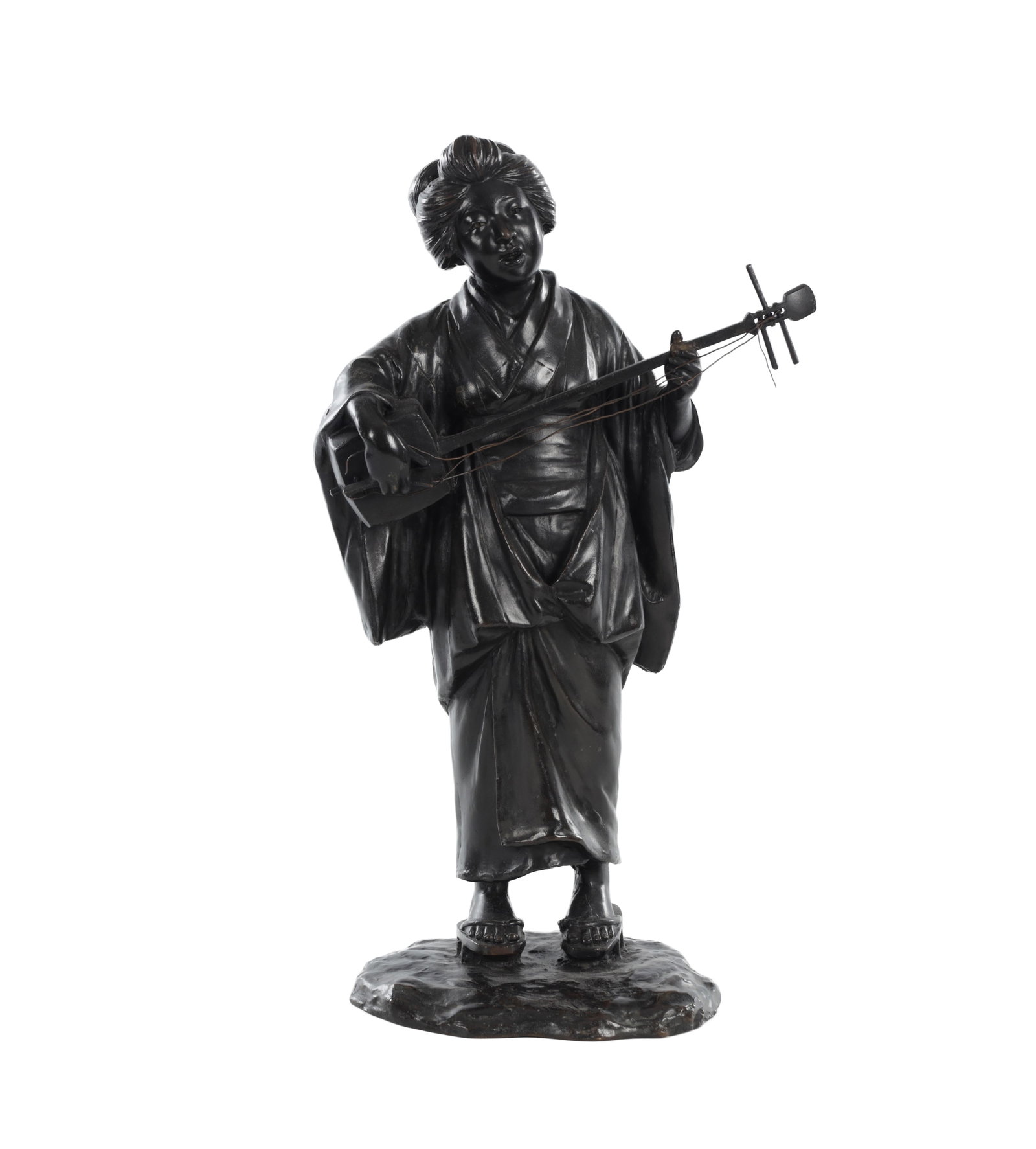 A JAPANESE MEIJI PERIOD PATINATED BRONZE FIGURE OF A GEISHA WITH SHAMISEN: A JAPANESE MEIJI PERIOD PATINATED BRONZE FIGURE OF A GEISHA WITH SHAMISEN standing and holding a shamisen and bachi, wearing traditional robes and sandals, her hair arranged in an elaborate coiffure,