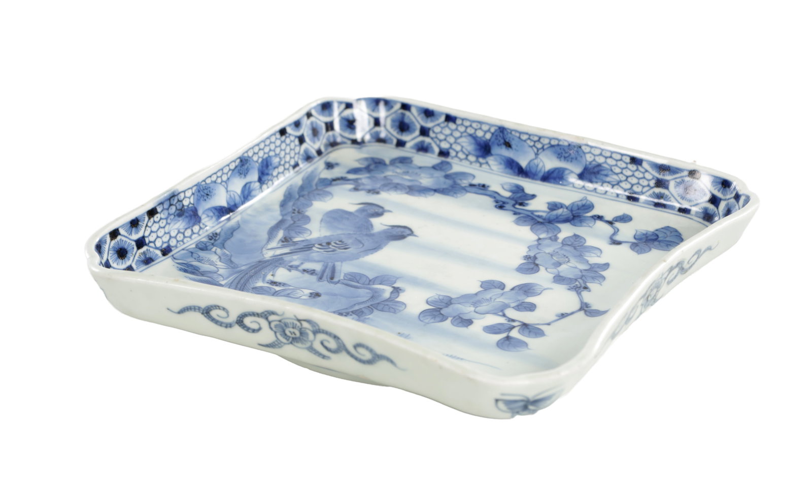 A 20TH CENTURY CHINESE BLUE AND WHITE PORCELAIN SQUARE DISH: A 20TH CENTURY CHINESE BLUE AND WHITE PORCELAIN SQUARE DISH with shaped corners, the centre painted with two birds perched upon a flowering branch above stylised rockwork, within a floral border with