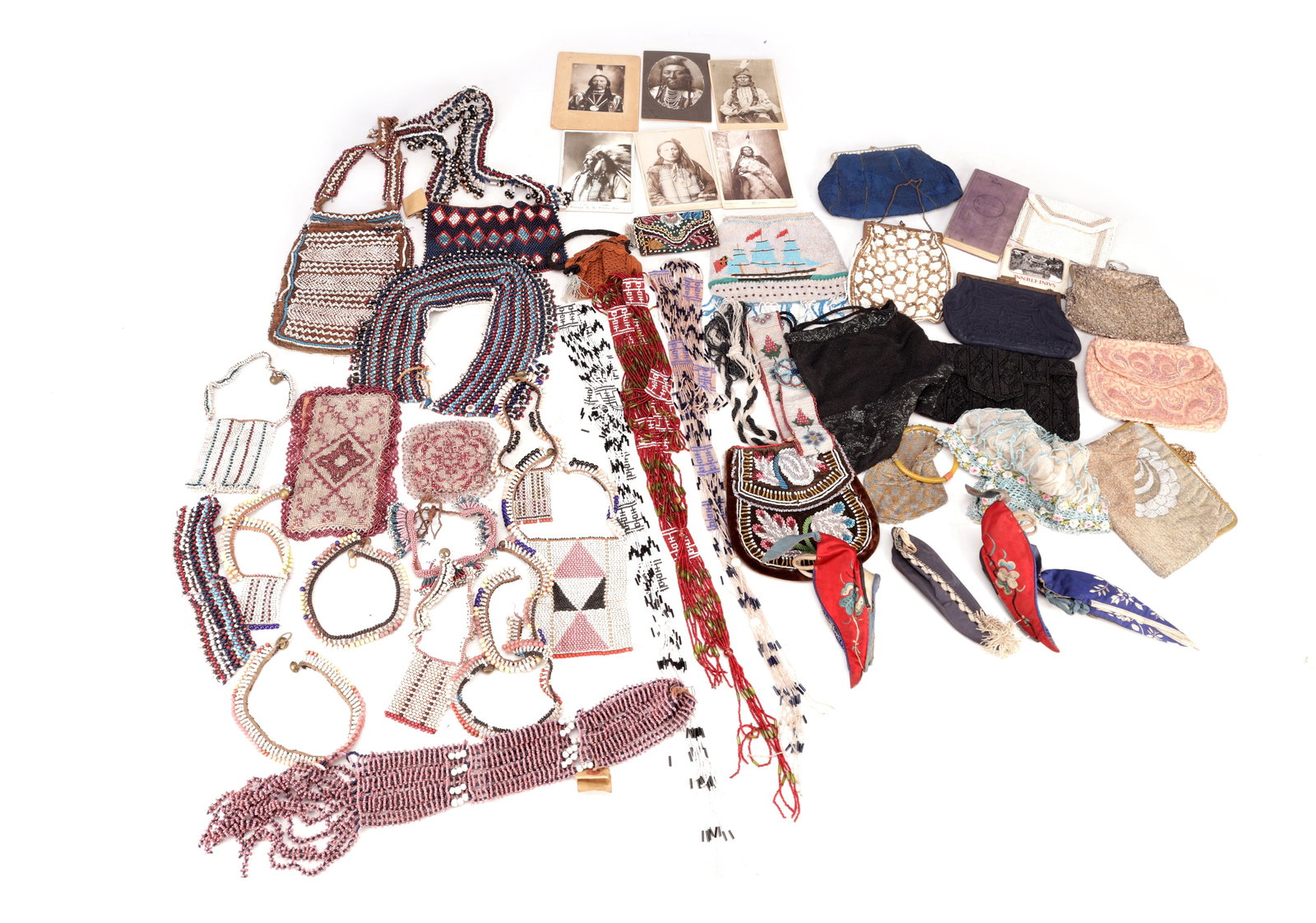 A COLLECTION OF AFRICAN, ORIENTAL AND NATIVE AMERICAN BEADED WORK: A COLLECTION OF AFRICAN, ORIENTAL AND NATIVE AMERICAN BEADED WORK including collars, necklaces, pouches, bead panels and tasselled strips, together with assorted embroidered purses and textiles and a
