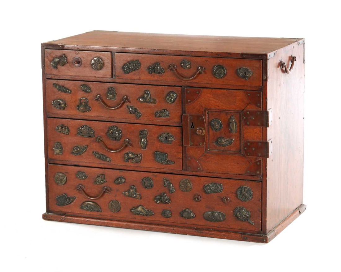 A JAPANESE MEIJI PERIOD STAINED WOOD COLLECTOR'S CABINET: A JAPANESE MEIJI PERIOD STAINED WOOD COLLECTOR'S CABINET fitted with gilt bronze menuki, comprising of small drawers and a side cupboard. (37cm wide, 20.5cm deep, 28cm high)