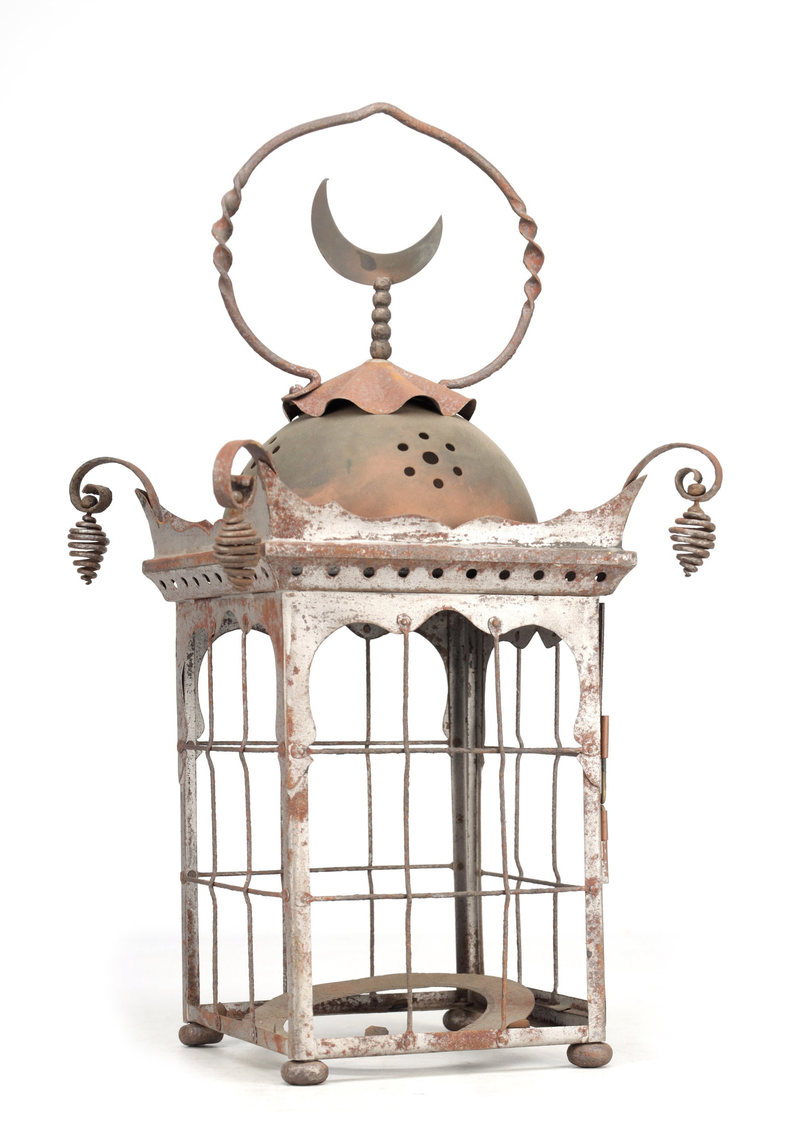 A 19TH CENTURY ORIENTAL STEEL LANTERN WITH CRESCENT FINIAL: A 19TH CENTURY ORIENTAL STEEL LANTERN WITH CRESCENT FINIAL of square section with arched window panels and wire grilles, a domed ventilated top beneath a scalloped collar, a twisted ring handle surmou