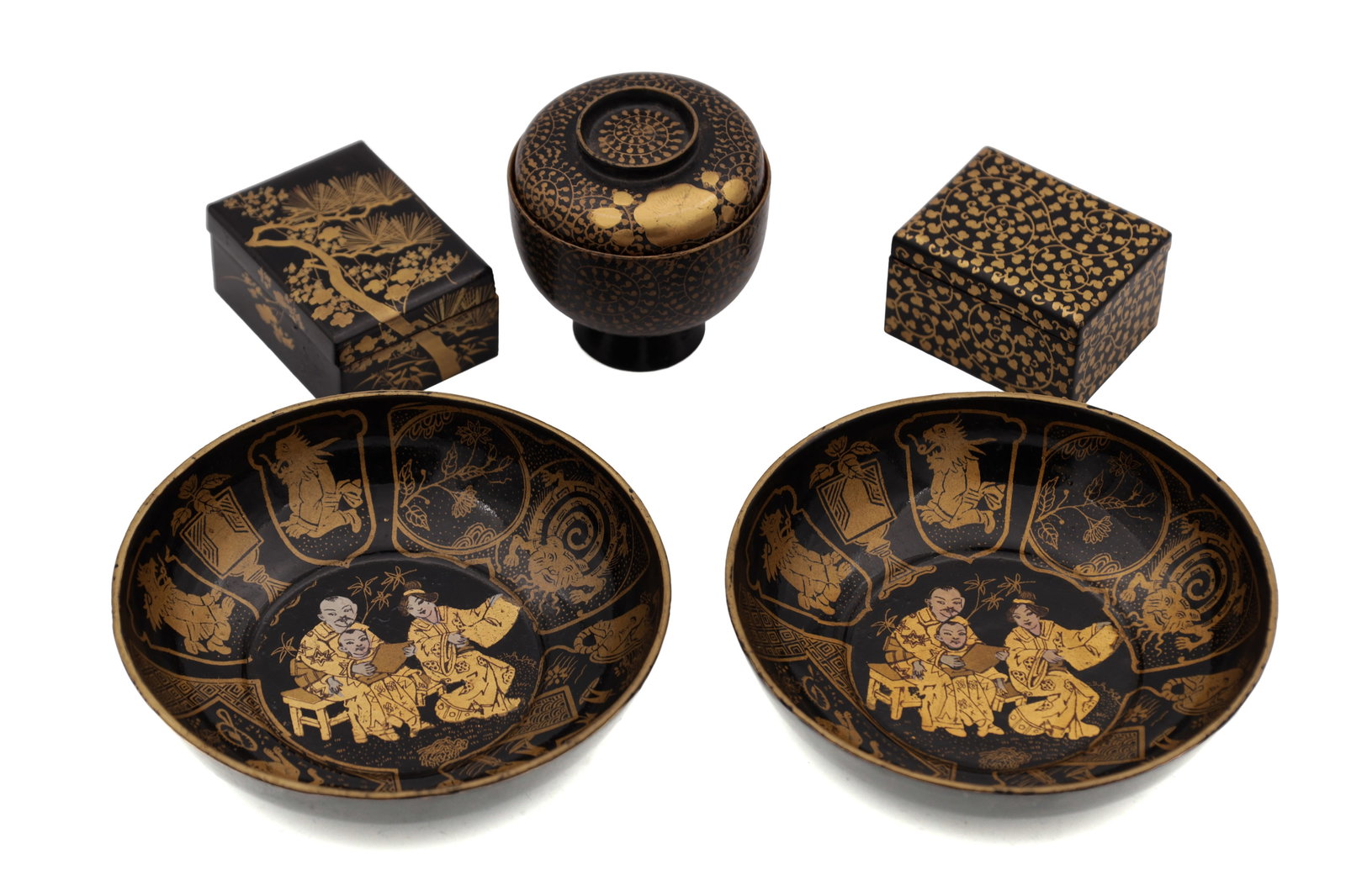 A COLLECTION OF 20TH CENTURY JAPANESE LACQUERWORK PIECES: A COLLECTION OF 20TH CENTURY JAPANESE LACQUERWORK PIECES comprising two small boxes with gilt decoration, a bowl and cover raised on a pedestal foot and a pair of bowls with gilt scene decoration to t