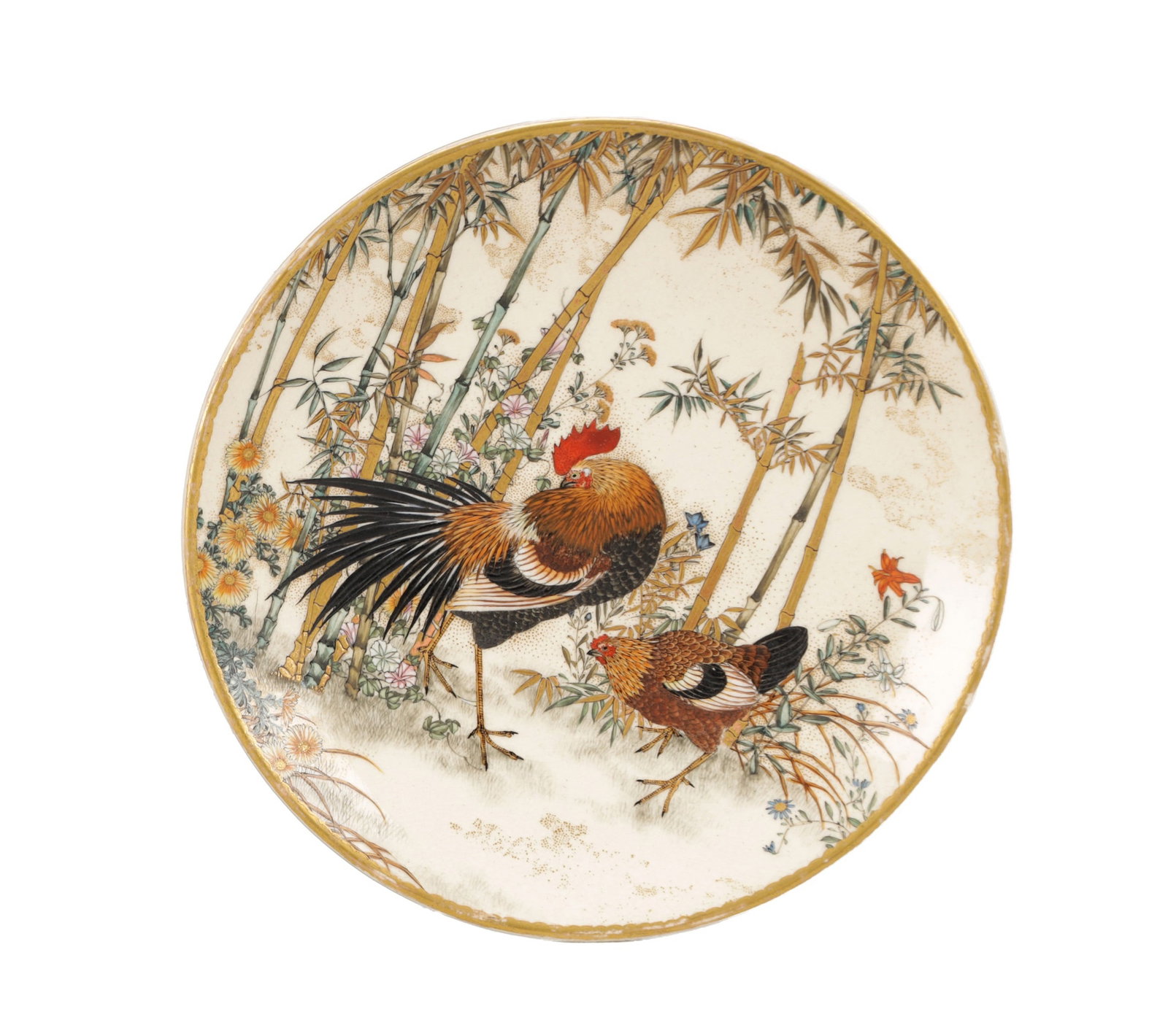 A SMALL JAPANESE MEIJI PERIOD SATSUMA DISH: A SMALL JAPANESE MEIJI PERIOD SATSUMA DISH of circular form with a gently everted rim, finely painted with a cockerel and hen amongst bamboo and flowering foliage, the border with gilt detailing, the