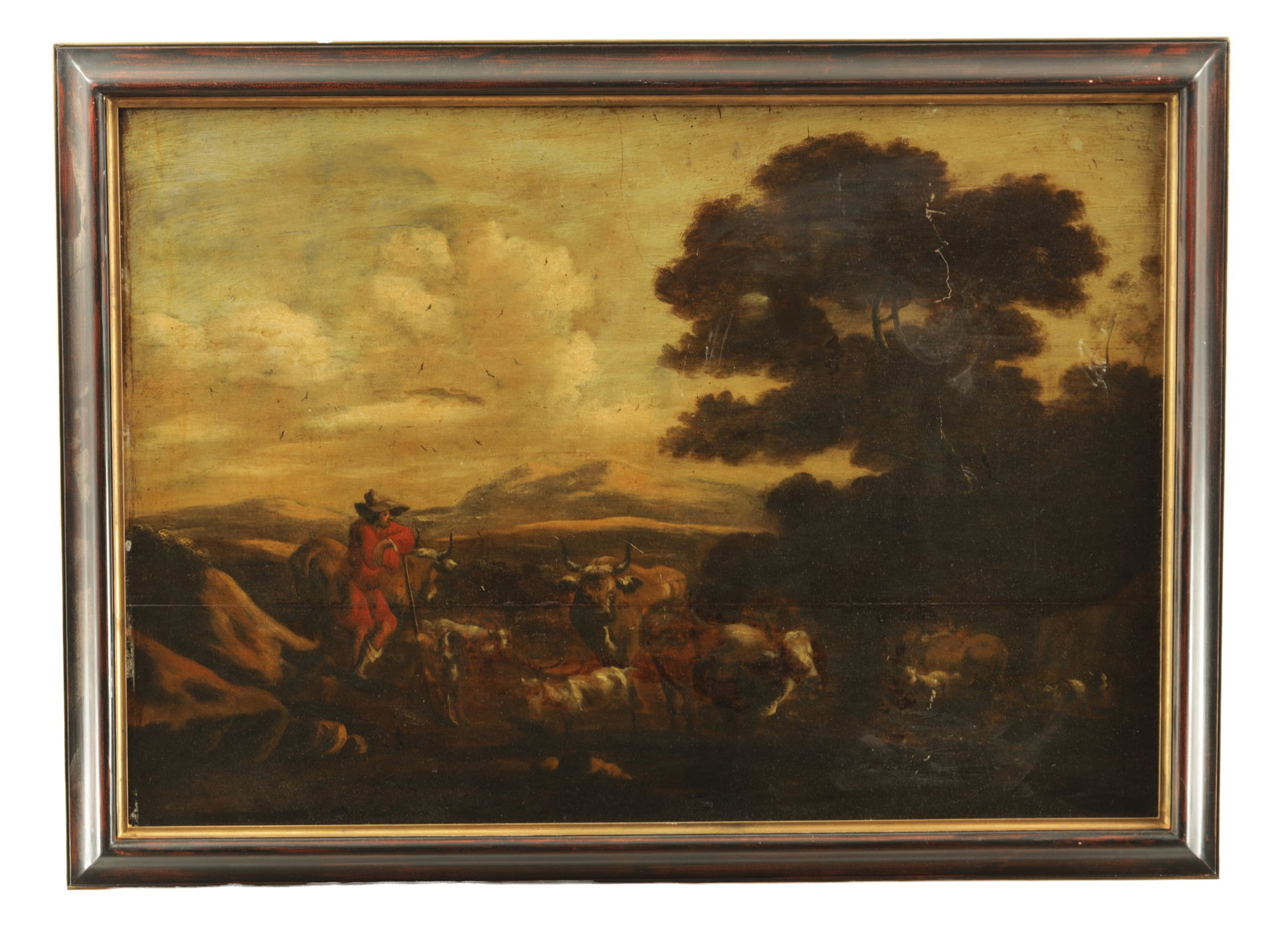 A LATE 18TH/ EARLY 19TH CENTURY OIL ON BOARD: A LATE 18TH/ EARLY 19TH CENTURY OIL ON BOARD depicting a landscape with a herdsmen, cattle, goats and dog, in a wood and gilt frame - unsigned. (57cm high and 81cm wide)