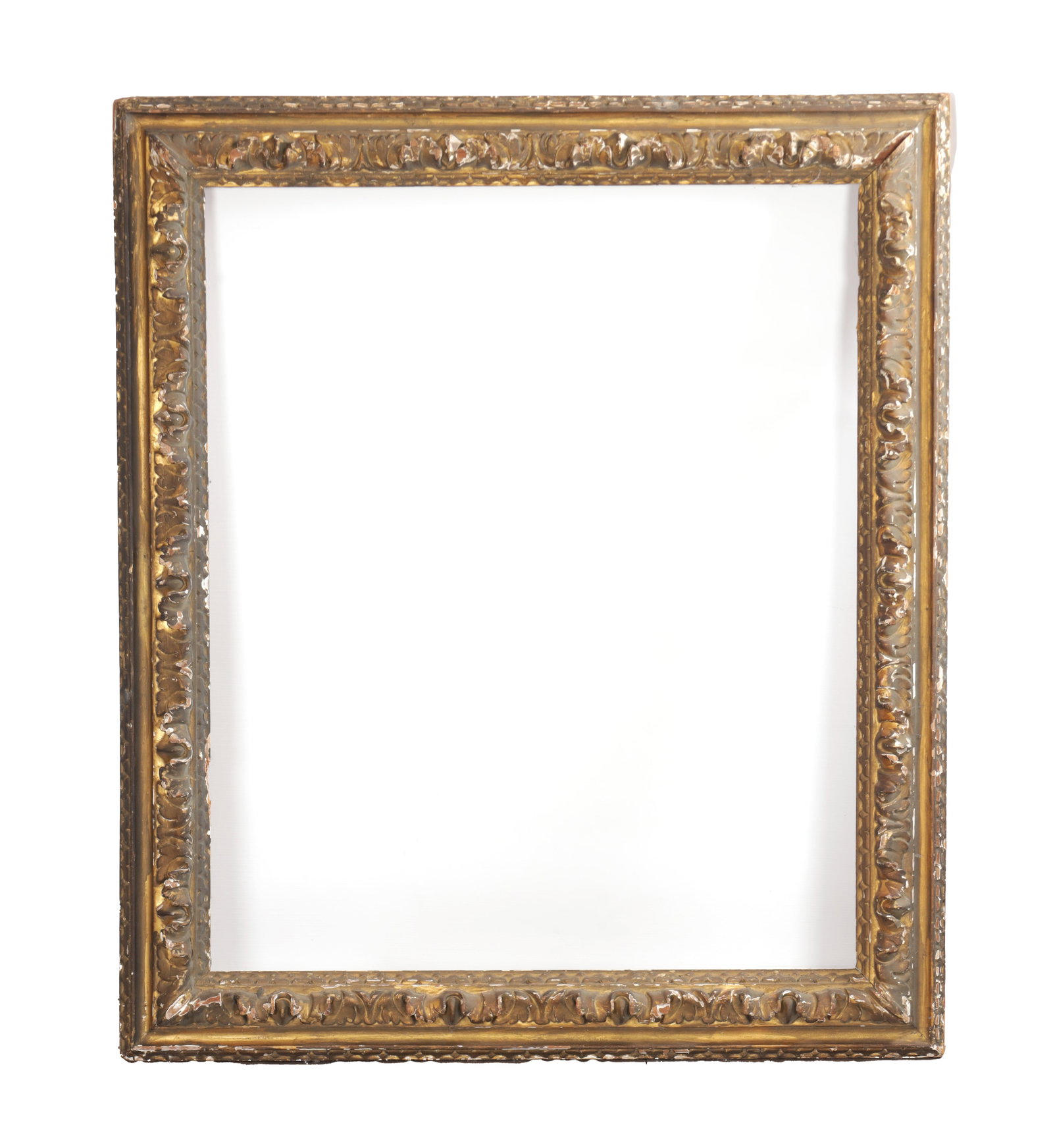 AN 18TH CENTURY CARVED AND GILTWOOD PICTURE FRAME: AN 18TH CENTURY CARVED AND GILTWOOD PICTURE FRAME of rectangular form with a moulded sight edge and all-round foliate-carved frieze with leaf-tip outer moulding. (108cm high, 98cm wide)