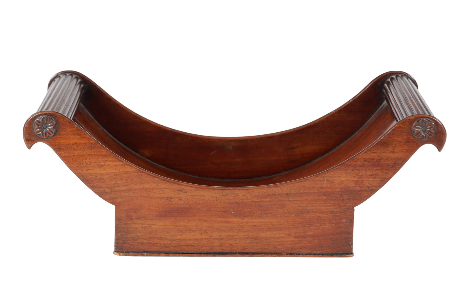 A GEORGE III MAHOGANY CHEESE COASTER: A GEORGE III MAHOGANY CHEESE COASTER of shaped form with carved rosette decoration. (50cm wide, 25cm deep and 18cm high)