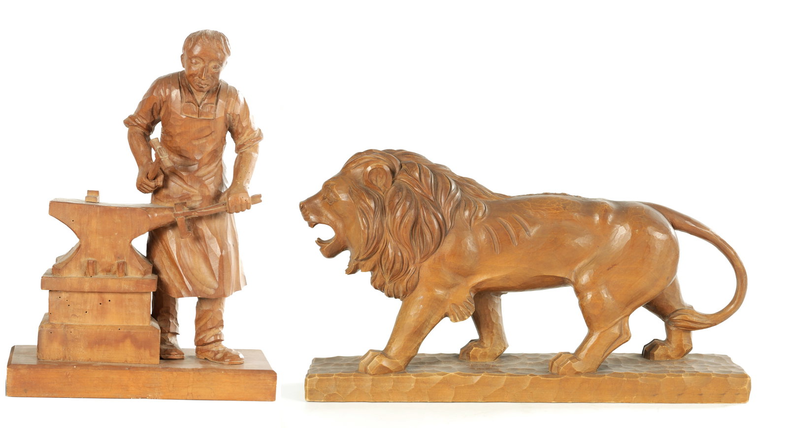 TWO LATE 20TH CENTURY CARVINGS: TWO LATE 20TH CENTURY CARVINGS one modelled as a lion, the other modelled as a farrier. The lion sculpture is stamped on the base. (Lion 28cm high and 50cm wide. Farrier 38cm high and 27cm wide.)