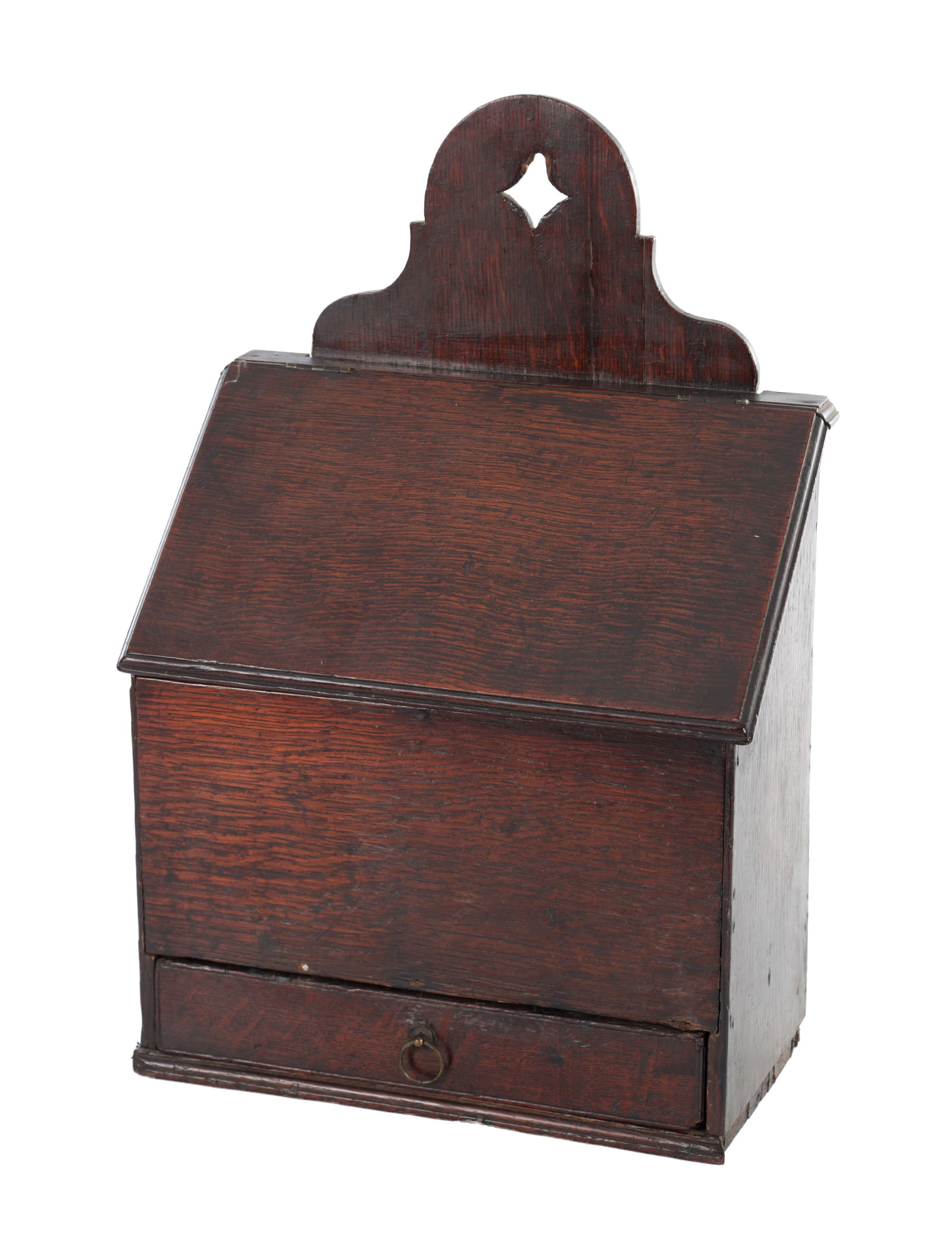 AN 18TH CENTURY OAK WALL MOUNTED CANDLE BOX: AN 18TH CENTURY OAK WALL MOUNTED CANDLE BOX the shaped backboard with a pierced hanging aperture above a sloping hinged lid opening to a divided interior, the front with a small pull-out drawer fitted