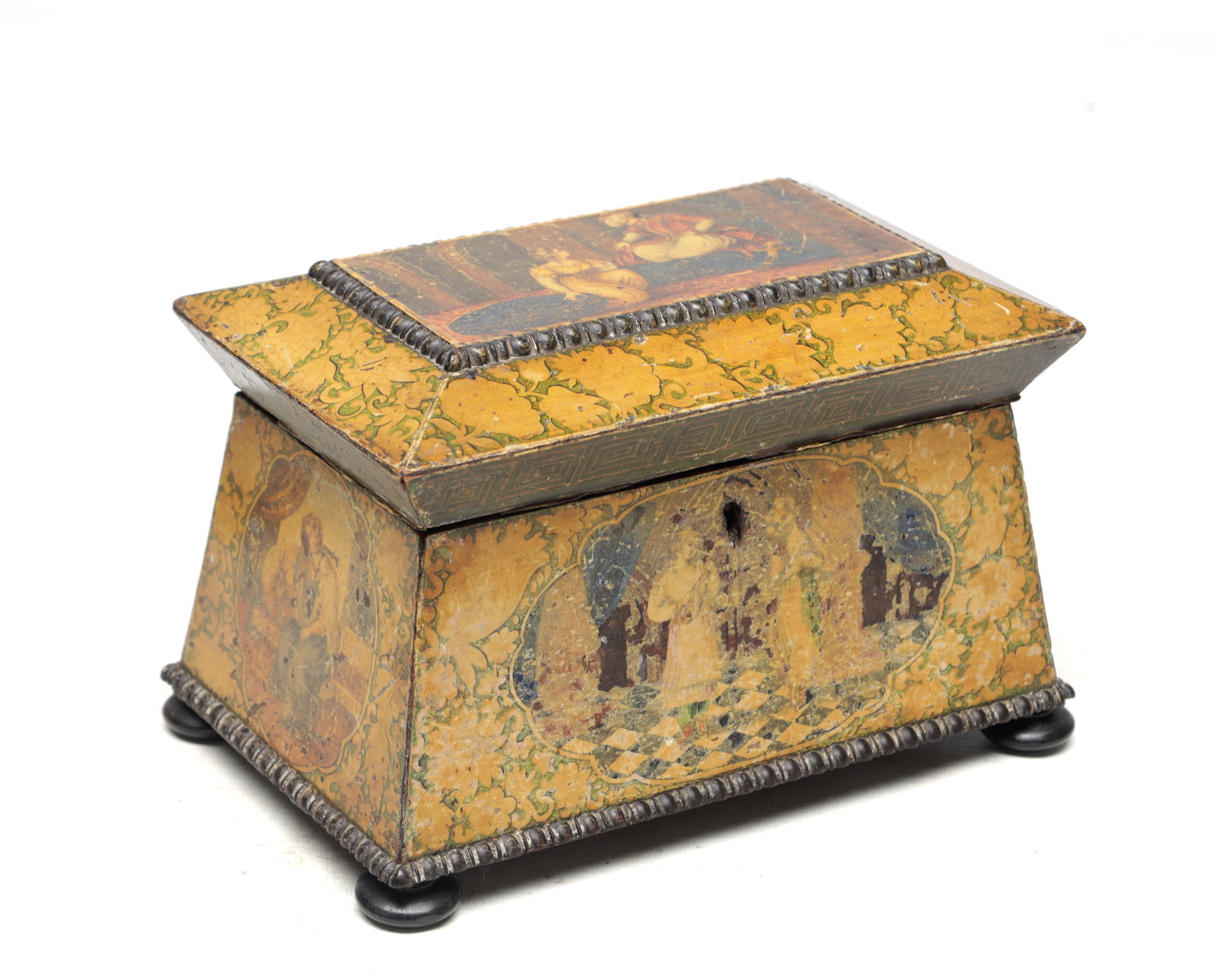 A 19TH CENTURY ENGLISH WITH PERSIAN DESIGN LACQUERWORK TEA CADDY: A 19TH CENTURY ENGLISH WITH PERSIAN DESIGN LACQUERWORK TEA CADDY of sarcophagus form with a sloping lid painted with courtly figures within floral scroll borders, the tapering sides with figural reser