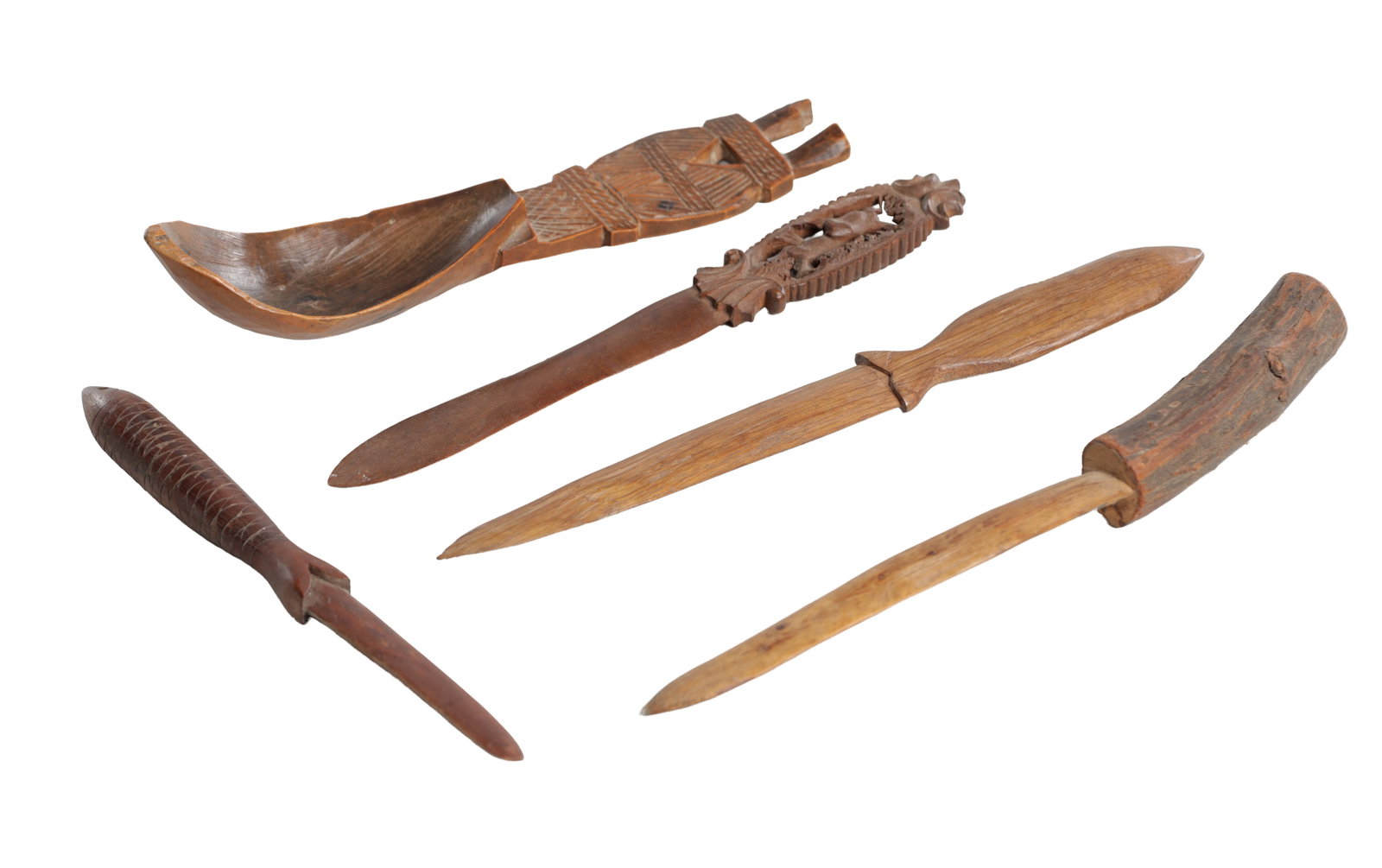 A COLLECTION OF 19TH AND EARLY 20TH CENTURY CARVED WOOD TREEN ITEMS: A COLLECTION OF 19TH AND EARLY 20TH CENTURY CARVED WOOD TREEN ITEMS comprising a large carved wooden spoon with geometric chip carved handle, a letter opener with carved fish handle, a small carved wo