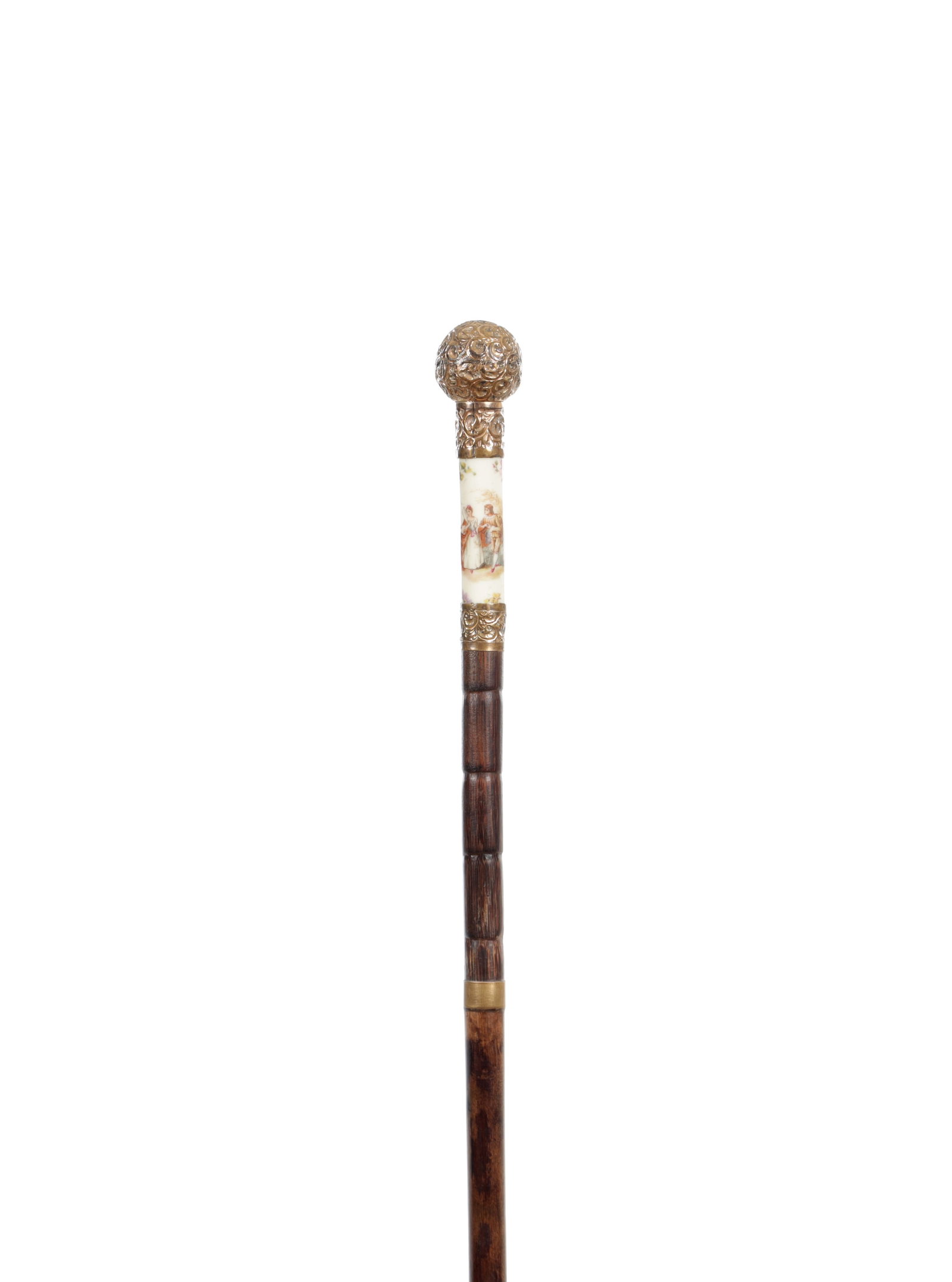 A 19TH CENTURY GOLD PLATED AND PORCELAIN MOUNTED WALKING CANE: A 19TH CENTURY GOLD PLATED AND PORCELAIN MOUNTED WALKING CANE with a gold plated spherical knop above repoussé scroll mounts and a porcelain panel painted with figures and floral sprays, above a segm