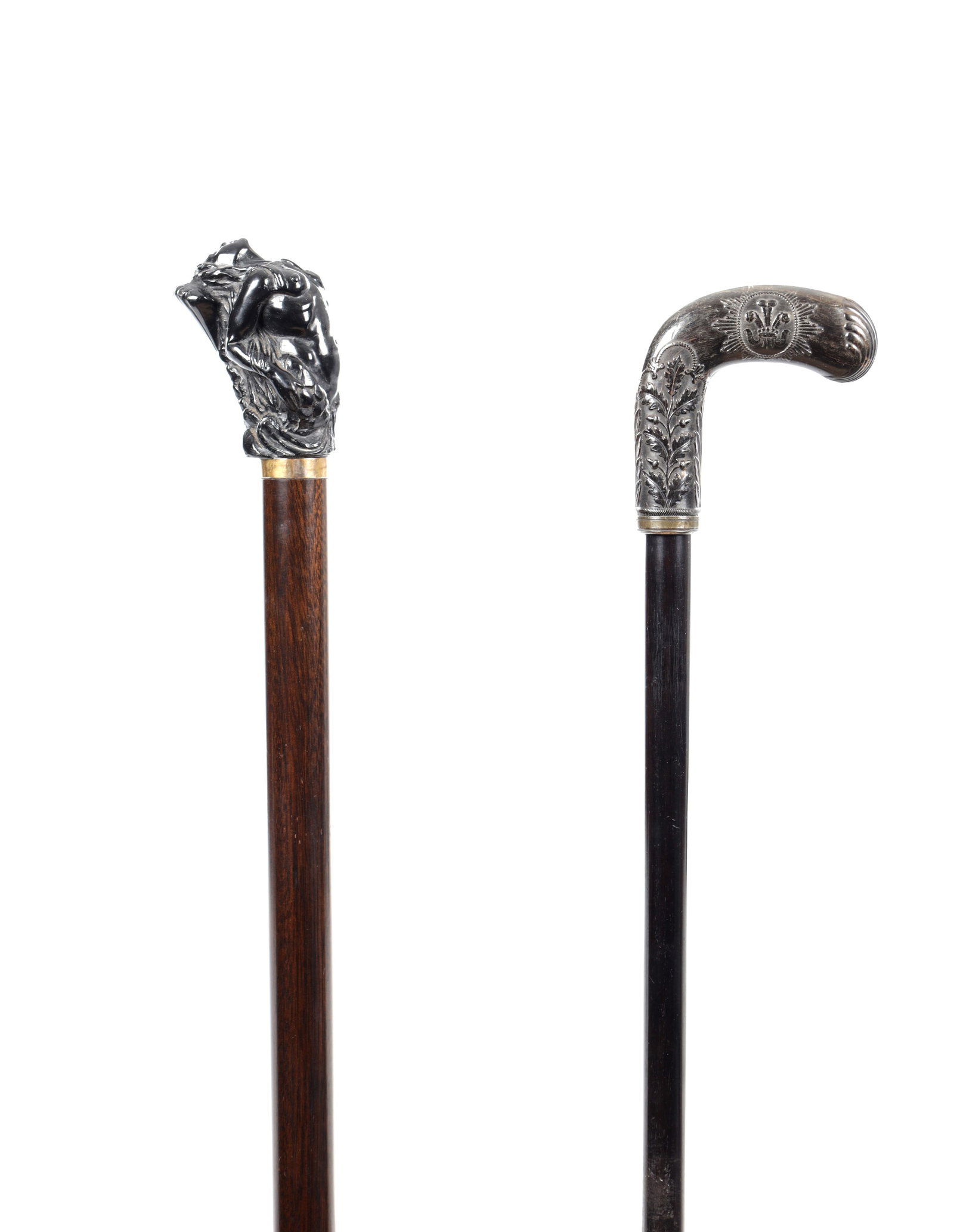 TWO 19TH/20TH CENTURY WALKING CANES: TWO 19TH/20TH CENTURY WALKING CANES, one is a mid-19th-century gutta-percha cane commemorating the memory of George IV, cast with a laurel and the king's profile amid sunbeams on one side, and an oak