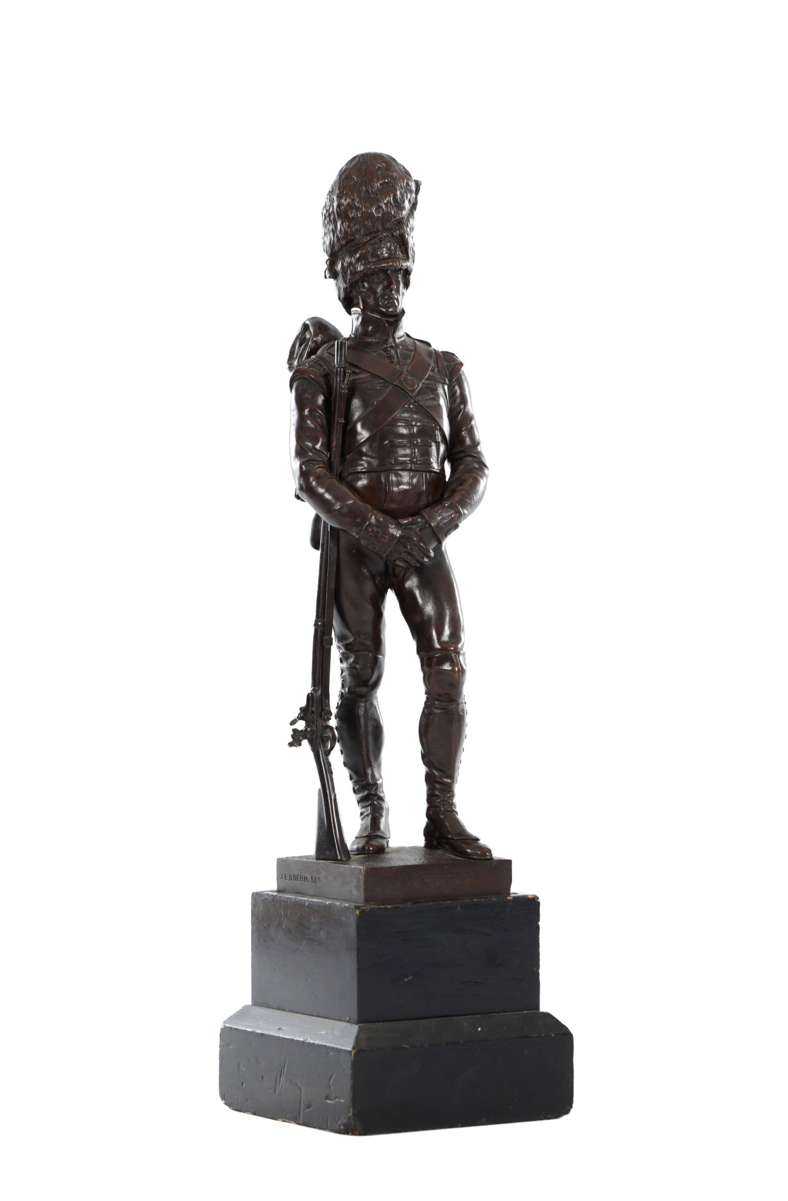 AFTER SIR JOSEPH EDGAR BOEHM (1834 - 1890) A BRONZE FIGURE OF A GRENADIER GUARD: AFTER SIR JOSEPH EDGAR BOEHM (1834 - 1890) A BRONZE FIGURE OF A GRENADIER GUARD cast in bronze with a brown patination, depicting a standing grenadier of the 1st Guards wearing a bearskin and holding