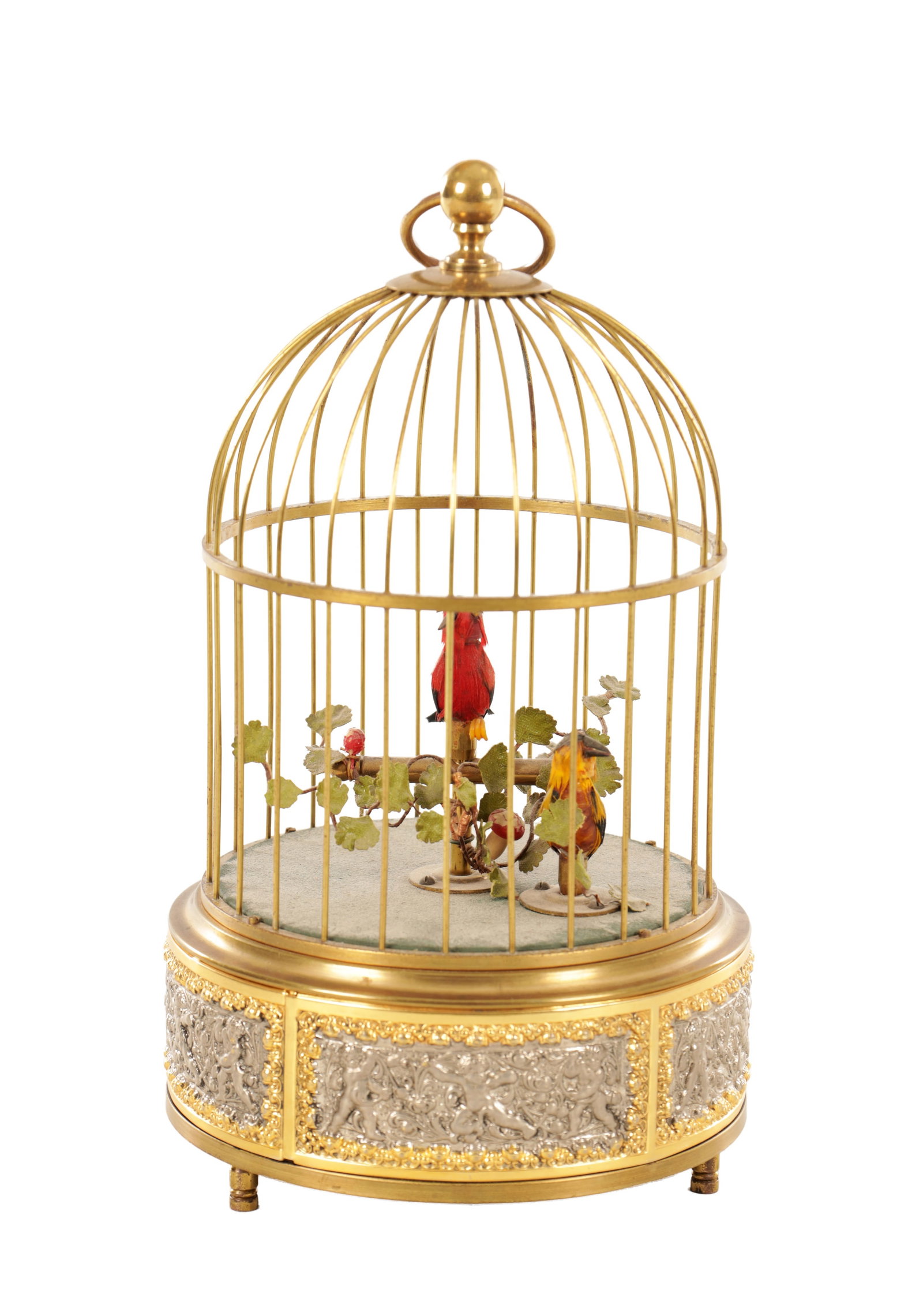 A 20TH CENTURY SINGING BIRD AUTOMATION: A 20TH CENTURY SINGING BIRD AUTOMATION uniquely having two singing birds which both open and close their beaks, and move their heads and tail feathers. Encased in a brass gilded cage. (25cm high )