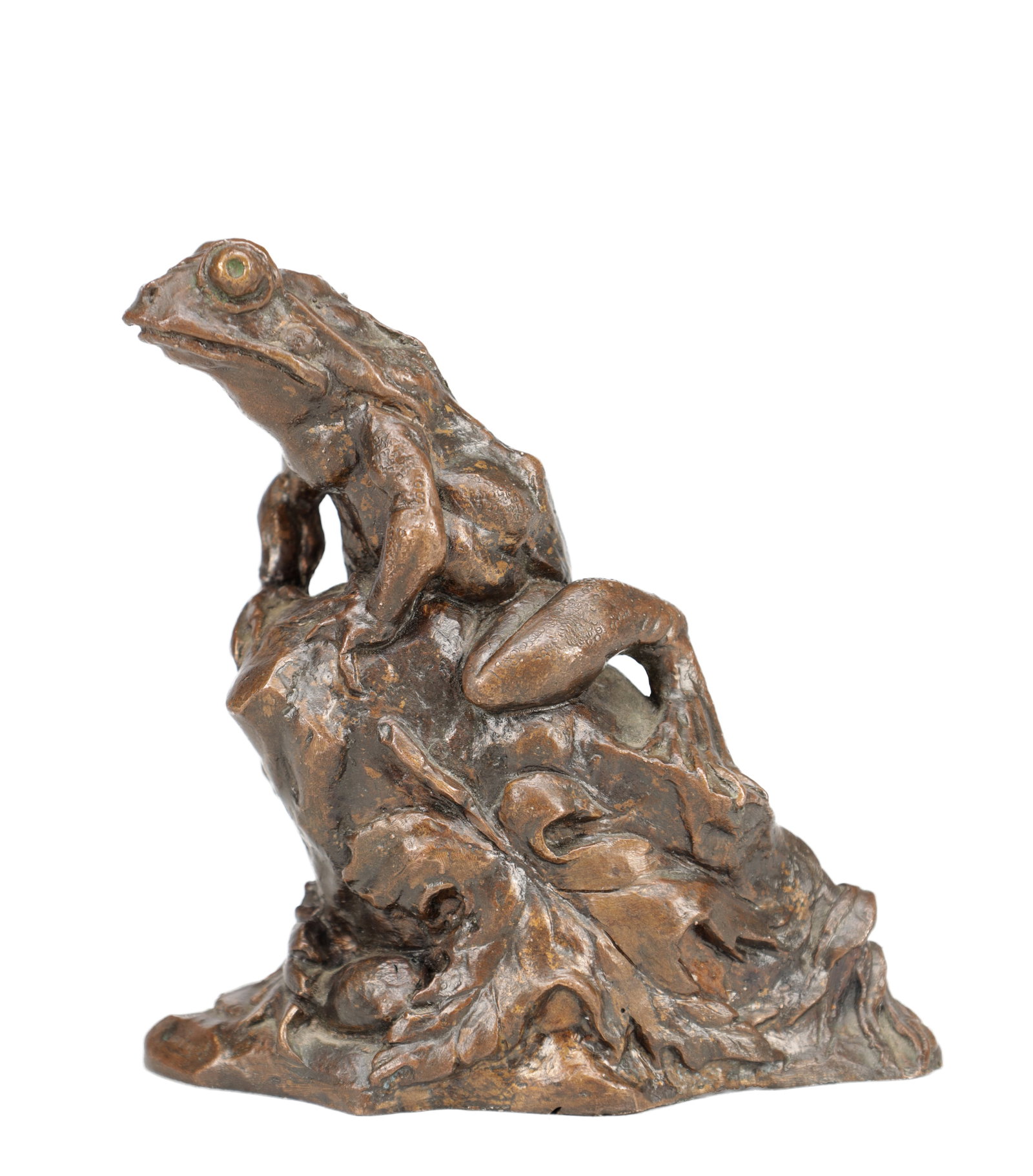 A 19TH CENTURY PATINATED BRONZE FROG ON ROCKY BASE: A 19TH CENTURY PATINATED BRONZE FROG ON ROCKY BASE modelled perched alert upon a naturalistic rocky and foliate mound with textured skin and prominent eyes, with a dark brown patina, indistinctly sign