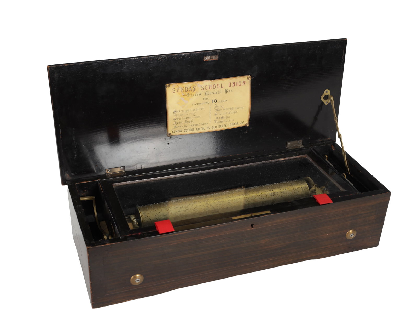 A LATE 19TH CENTURY SUNDAY SCHOOL UNION SACRED MUSICAL BOX: A LATE 19TH CENTURY SUNDAY SCHOOL UNION SACRED MUSICAL BOX the stained wooden case with hinged lid enclosing a brass pinned cylinder and steel comb movement, the interior lid with printed label titled