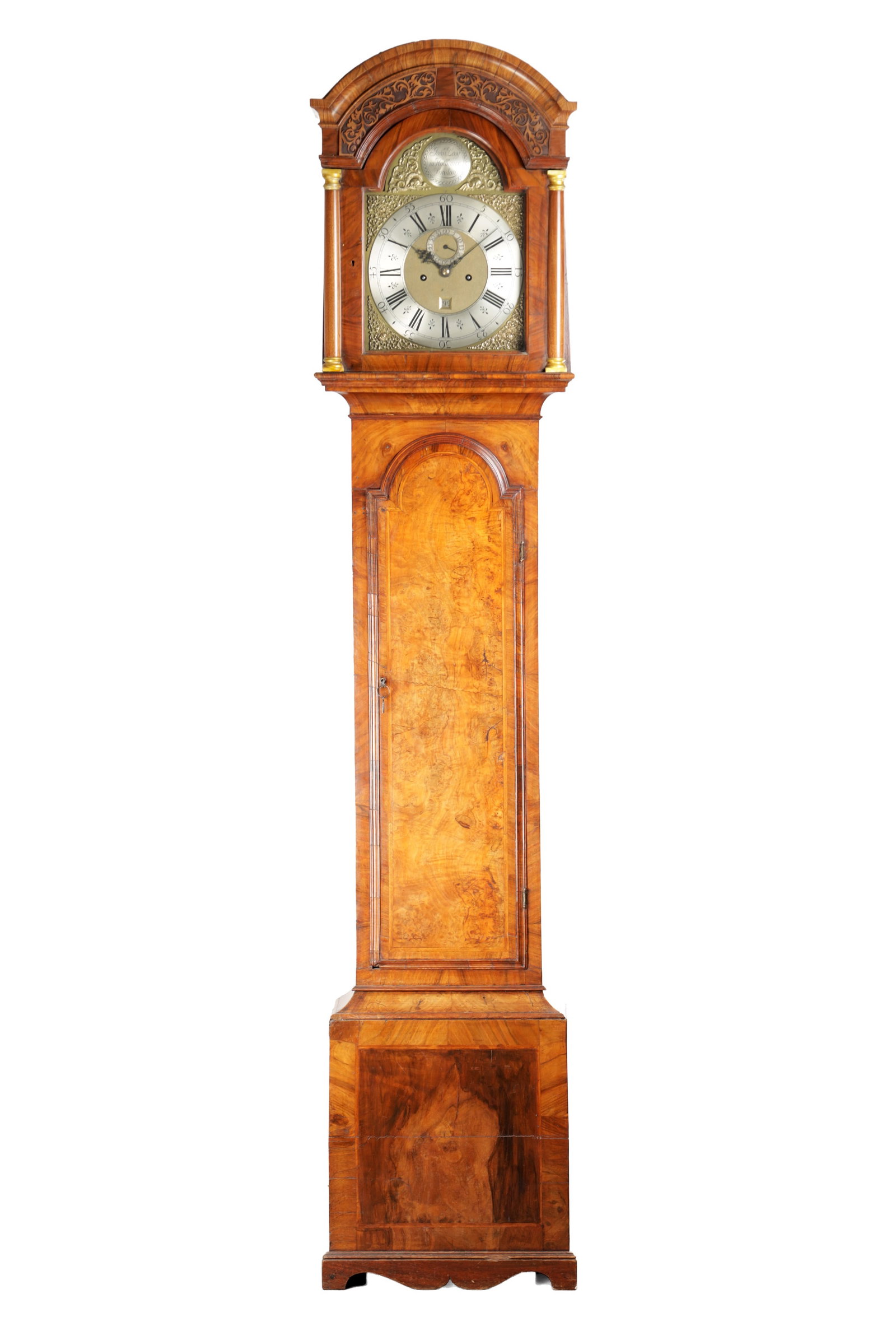 JOHN LEGG, IN HOLBURN, LONDON. AN EARLY 18TH CENTURY FIGURED WALNUT EIGHT-DAY LONGCASE CLOCK: JOHN LEGG, IN HOLBURN, LONDON. AN EARLY 18TH CENTURY FIGURED WALNUT EIGHT-DAY LONGCASE CLOCK with 12" arched brass dial, the five pillar movement with anchor escapement and inner rack strike, the figu