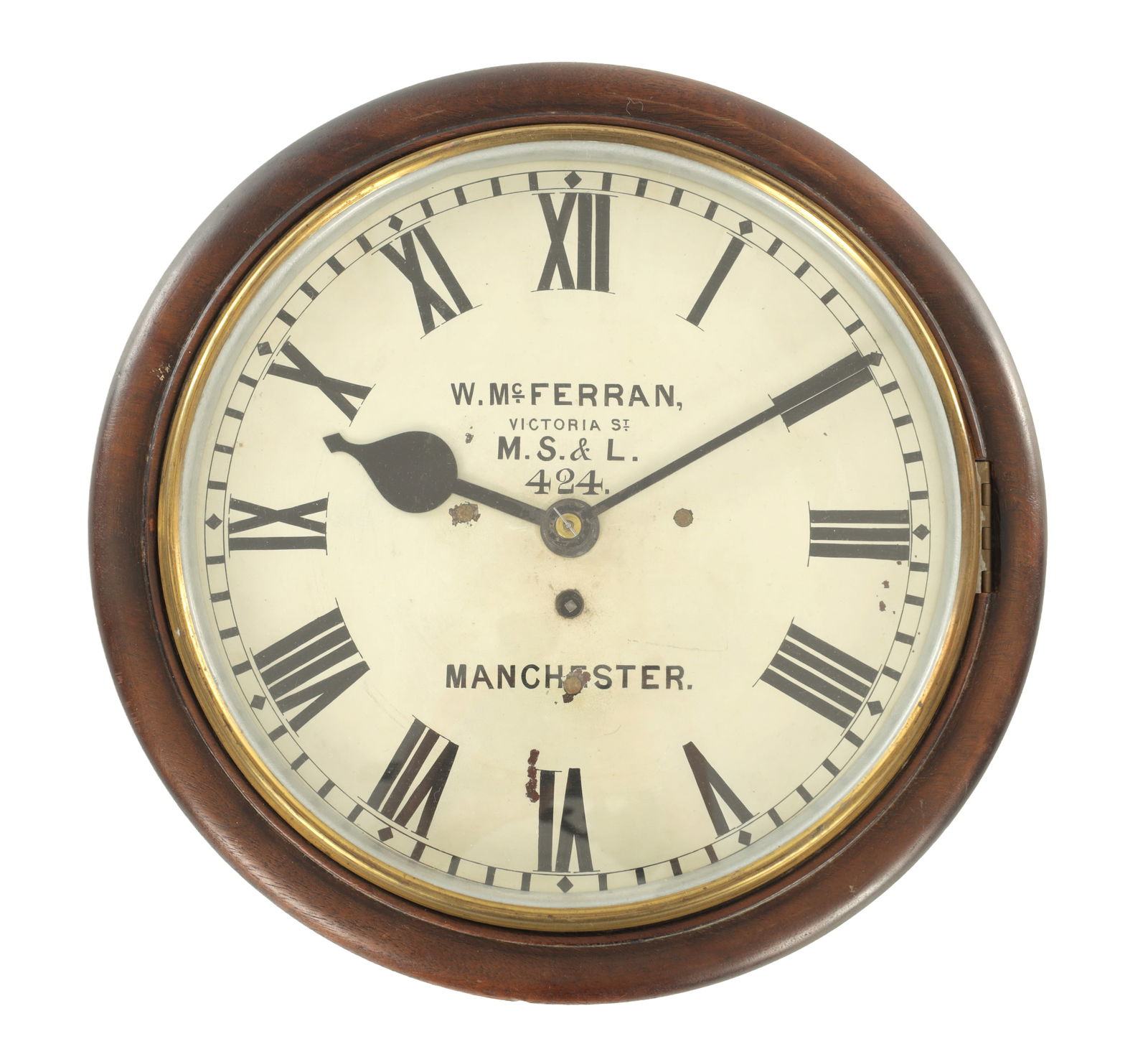 W. MC. FERRAN, VICTORIA STREET, M.S.& L. 424, MANCHESTER. A 19TH CENTURY MAHOGANY 12" FUSEE RAILWAY: W. MC. FERRAN, VICTORIA STREET, M.S.& L. 424, MANCHESTER. A 19TH CENTURY MAHOGANY 12" FUSEE RAILWAY WALL CLOCK the 12" painted dial with Roman numerals and signed centre, fronting an eight-day fusee m
