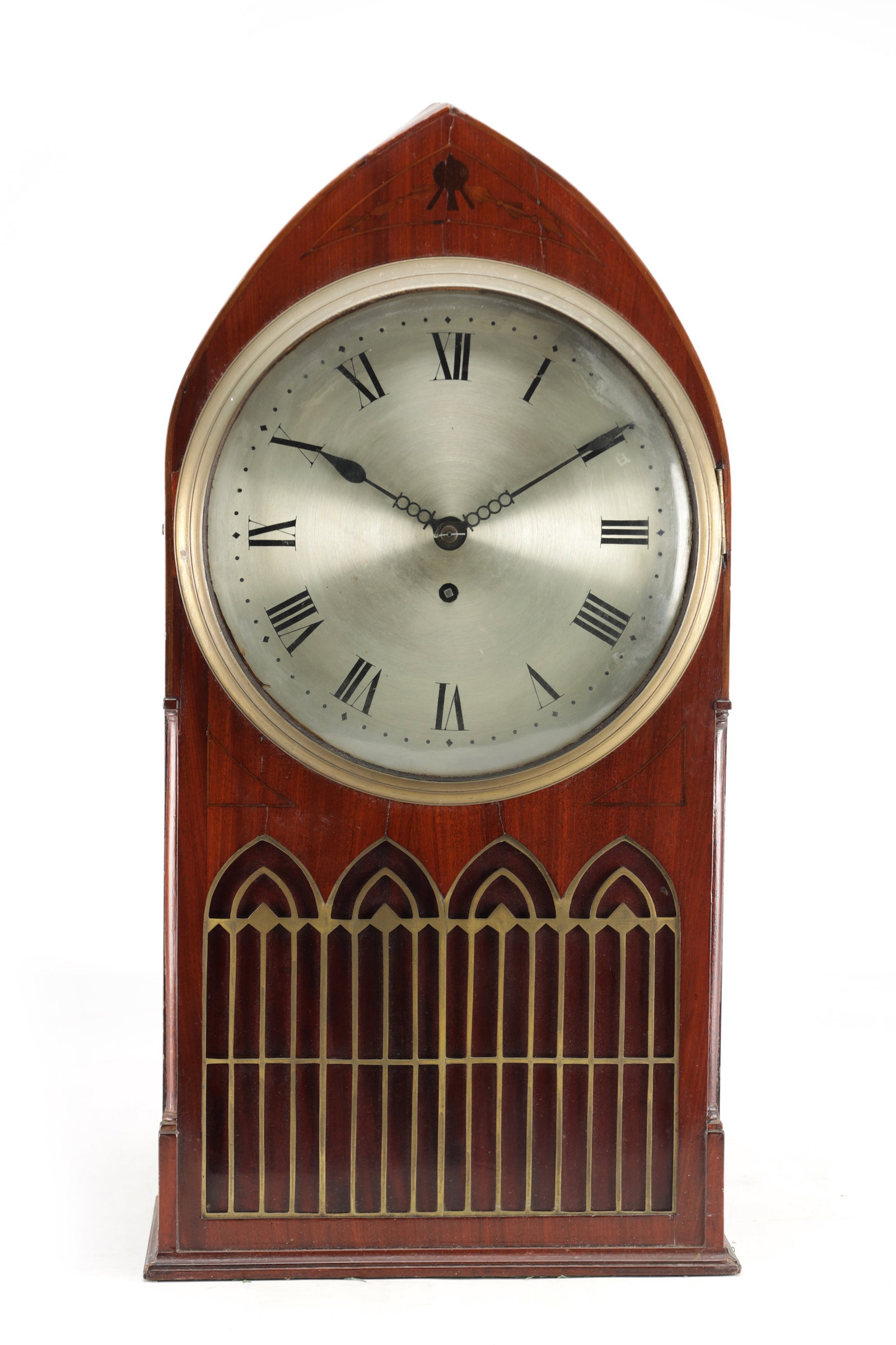 A LATE REGENCY MAHOGANY SINGLE FUSEE LANCET TOP BRACKET CLOCK: A LATE REGENCY MAHOGANY SINGLE FUSEE LANCET TOP BRACKET CLOCK with a silvered Roman dial and blued steel hands within a brass bezel, the lancet case with brass Gothic arched fret and line inlay, the m
