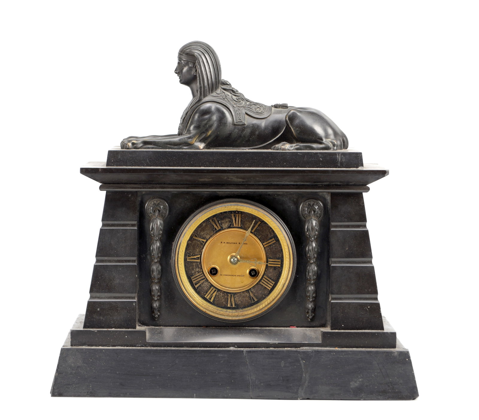 A 19TH CENTURY FRENCH BRONZE AND SLATE EGYPTIAN REVIVAL MANTEL CLOCK WITH SPHINX SURMOUNT: A 19TH CENTURY FRENCH BRONZE AND SLATE EGYPTIAN REVIVAL MANTEL CLOCK WITH SPHINX SURMOUNT of stepped architectural form with a recumbent bronze sphinx above a black slate case, having a circular gilt