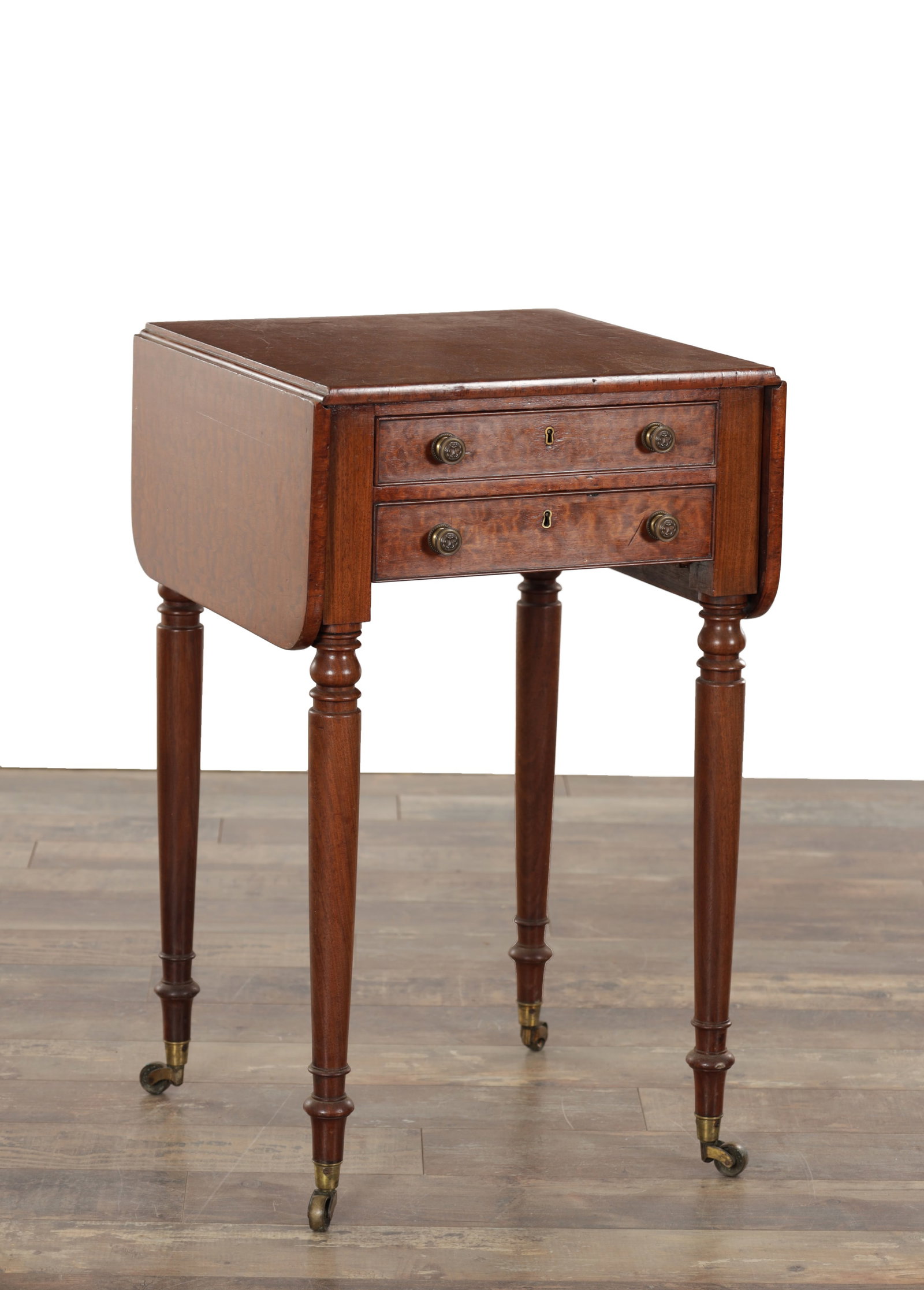 A 19TH CENTURY FIDDLEBACK MAHOGANY WORKBOX: A 19TH CENTURY FIDDLEBACK MAHOGANY WORKBOX with hinged sides above two freize drawers and raised on turned legs with under casters (47cm square 76cm high )
