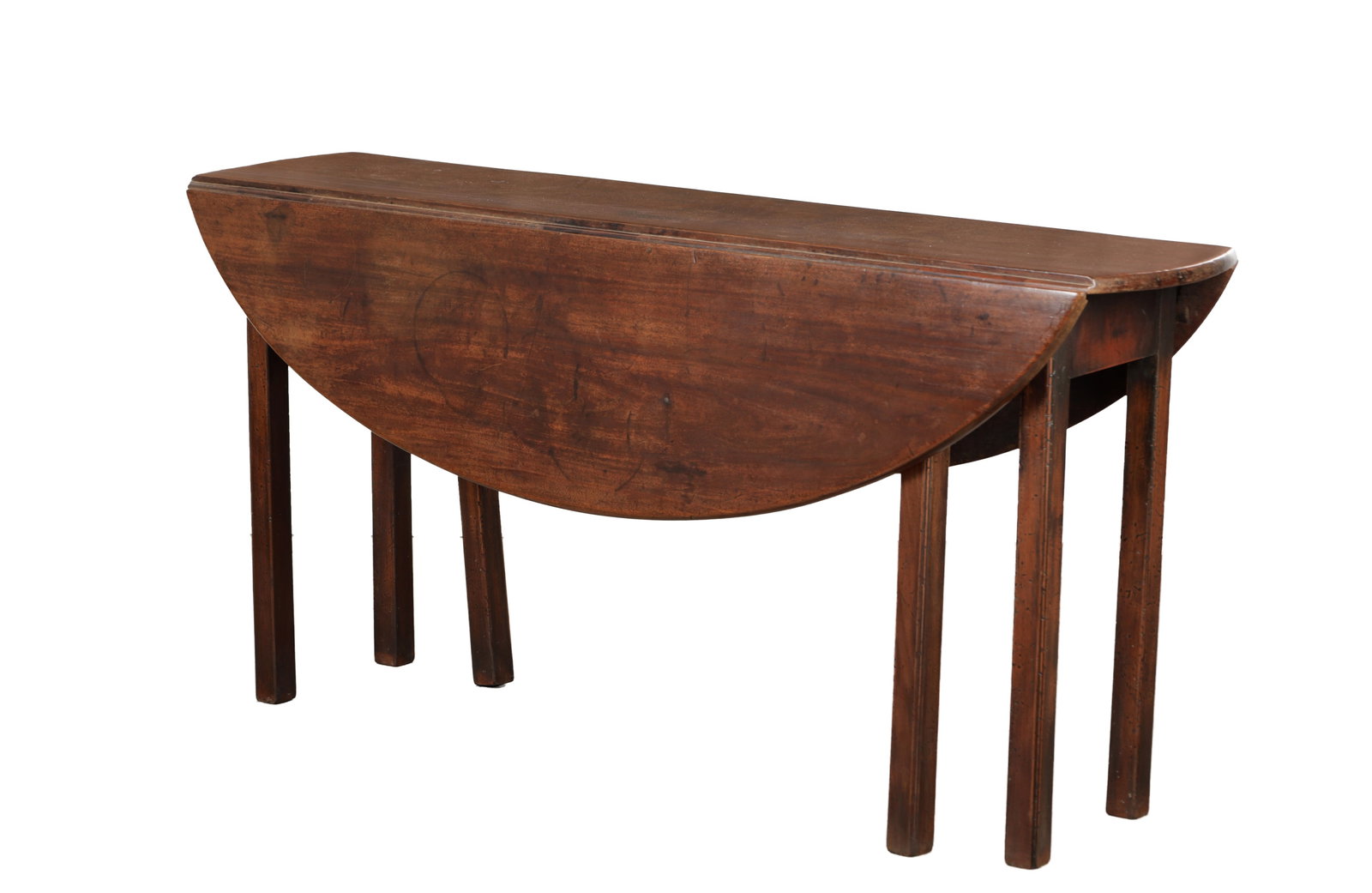 A GEORGE III MAHOGANY WAKE TABLE: A GEORGE III MAHOGANY WAKE TABLE of oval form with twin drop leaves, the leaves supported by double gateleg supports, raised on square section legs. (153cm wide 38cm deep closed 106cm open 74cm high)