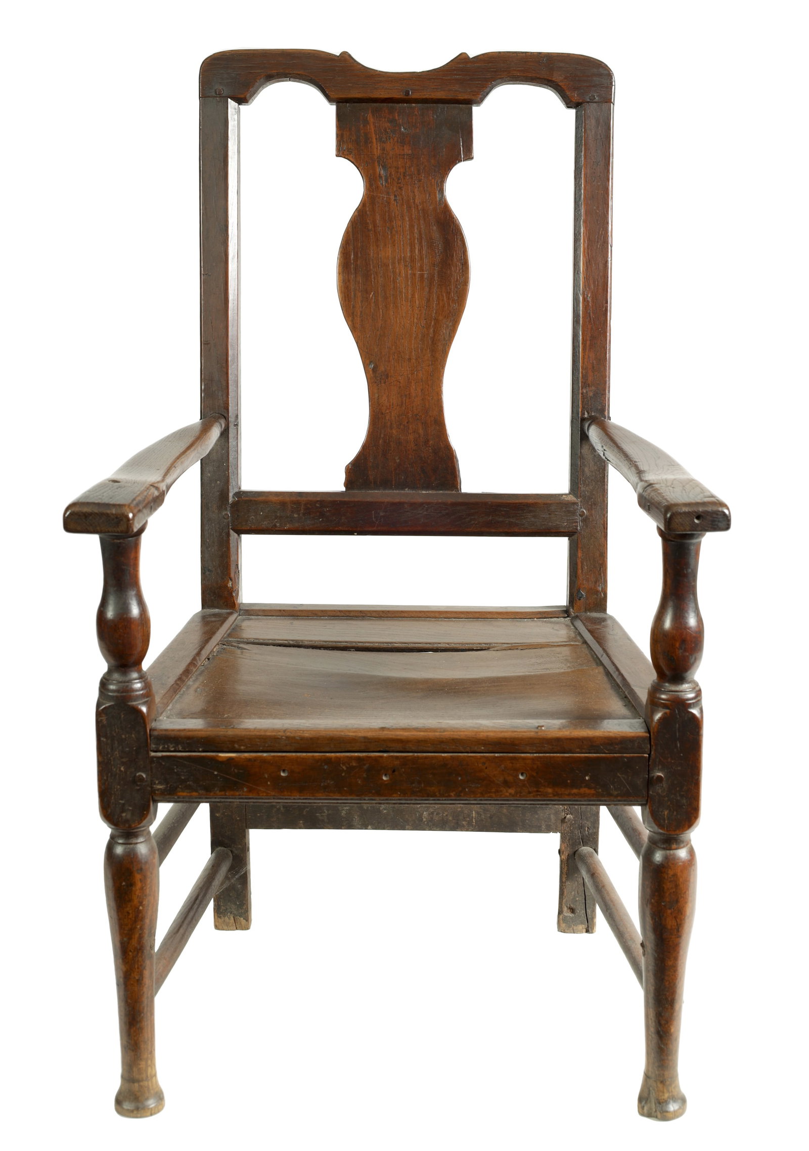 AN EARLY 18TH CENTURY OAK OPEN ARMCHAIR: AN EARLY 18TH CENTURY OAK OPEN ARMCHAIR with a shaped top rail and vase-shaped back splat above open arms on bulbous turned supports and a panelled seat, raised on turned legs united by stretchers. (6