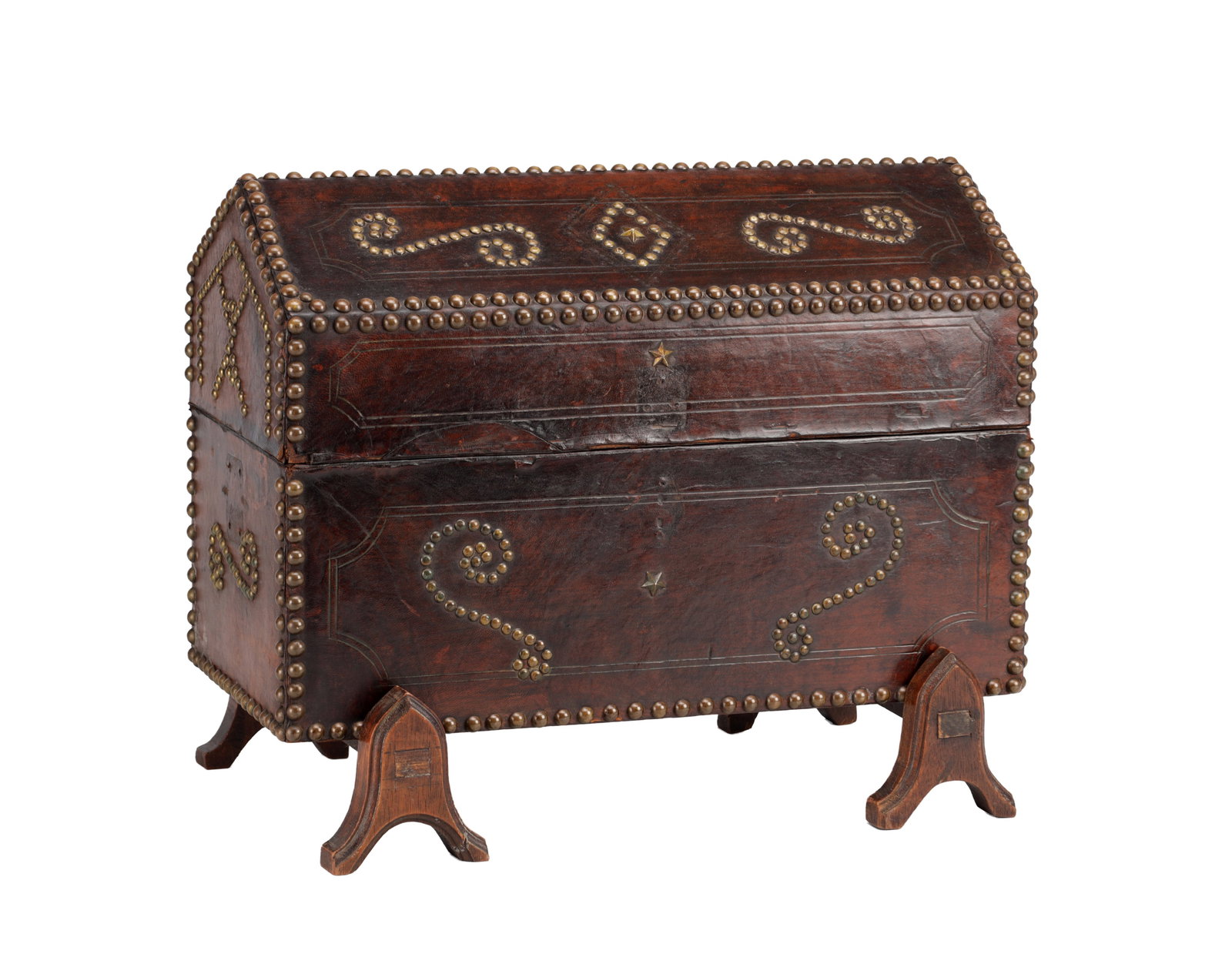 AN EARLY 19TH CENTURY NAIL-STUDDED LEATHER-BOUND WOOD BOX ON STAND: AN EARLY 19TH CENTURY NAIL-STUDDED LEATHER-BOUND WOOD BOX ON STAND of rectangular form with a domed hinged lid, the leather surface decorated with brass studwork forming scrolling motifs and borders,