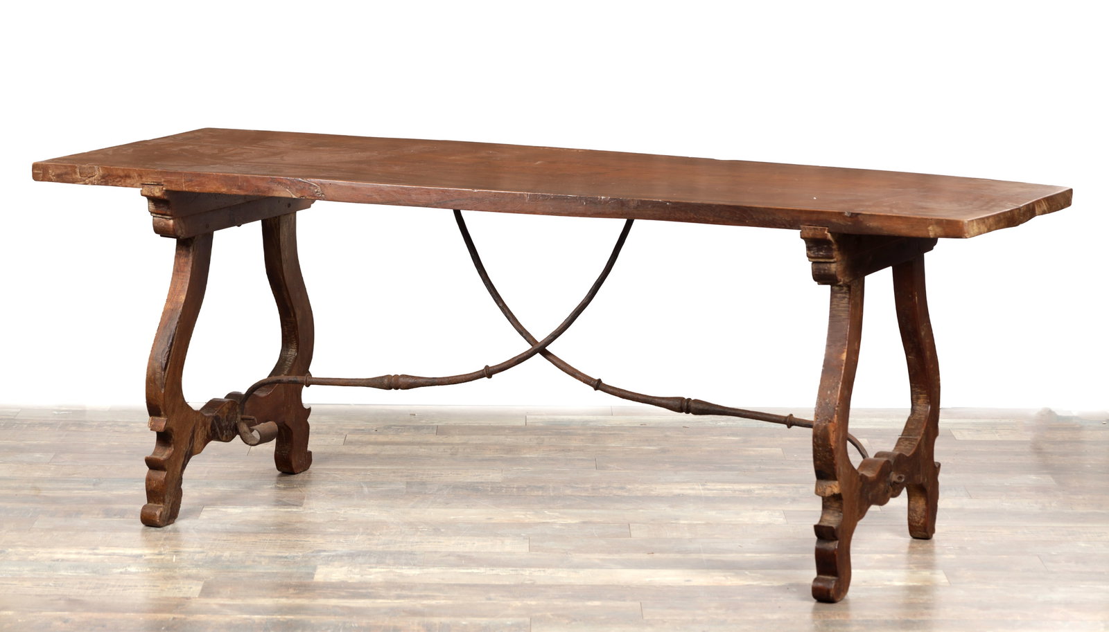 AN 18TH CENTURY SPANISH WALNUT HALL TABLE WITH ONE PIECE TOP: AN 18TH CENTURY SPANISH WALNUT HALL TABLE WITH ONE PIECE TOP of long rectangular form with a thick single slab top, the shaped trestle end supports with projecting brackets raised on block feet and un