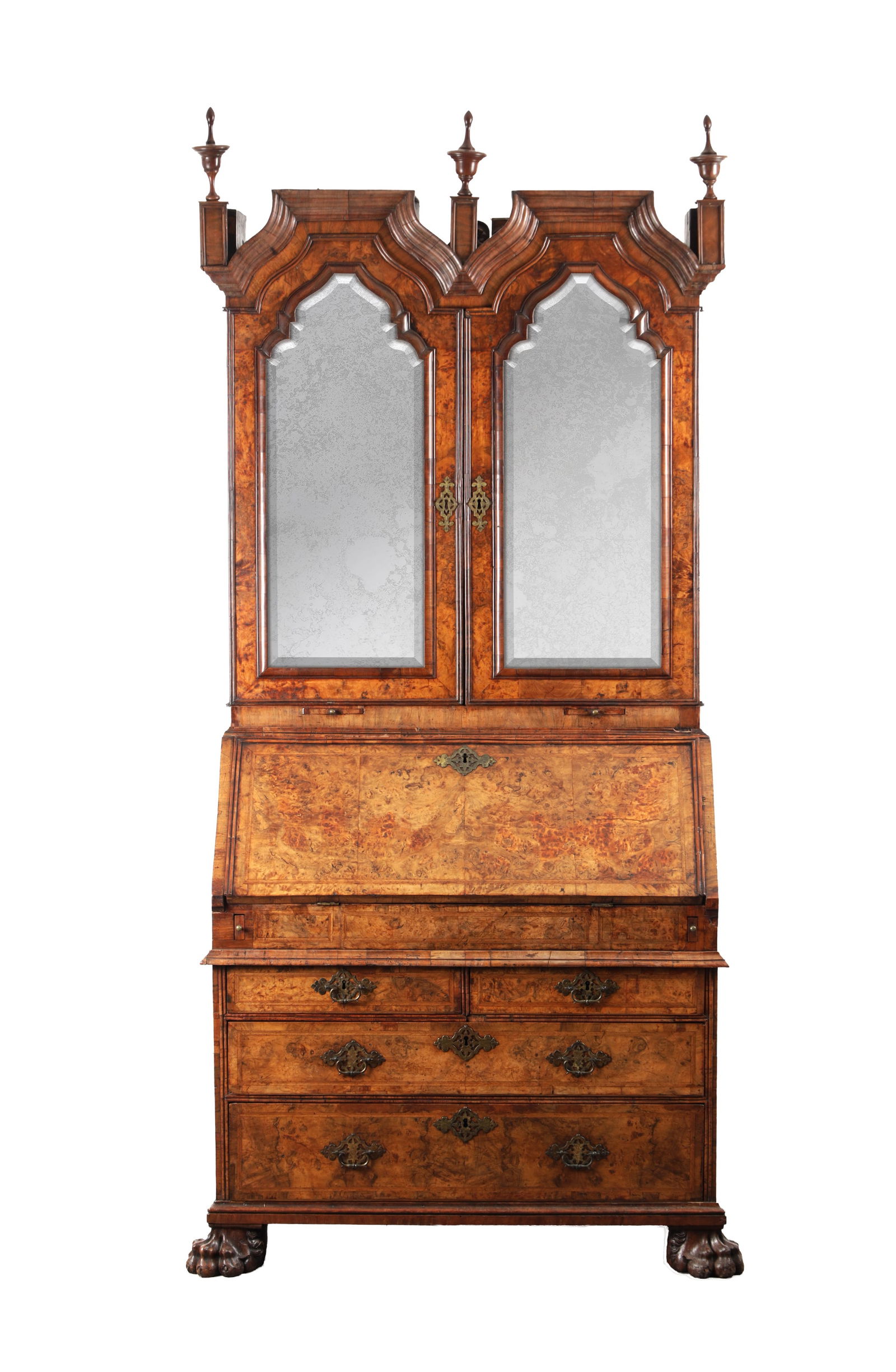 A GEORGE I BURR WALNUT BUREAU BOOKCASE WITH BROKEN ARCH PEDIMENT AND MIRRORED DOORS: A GEORGE I BURR WALNUT BUREAU BOOKCASE WITH BROKEN ARCH PEDIMENT AND MIRRORED DOORS of architectural form with a moulded broken arch cornice surmounted by urn finials, the upper section with a pair of