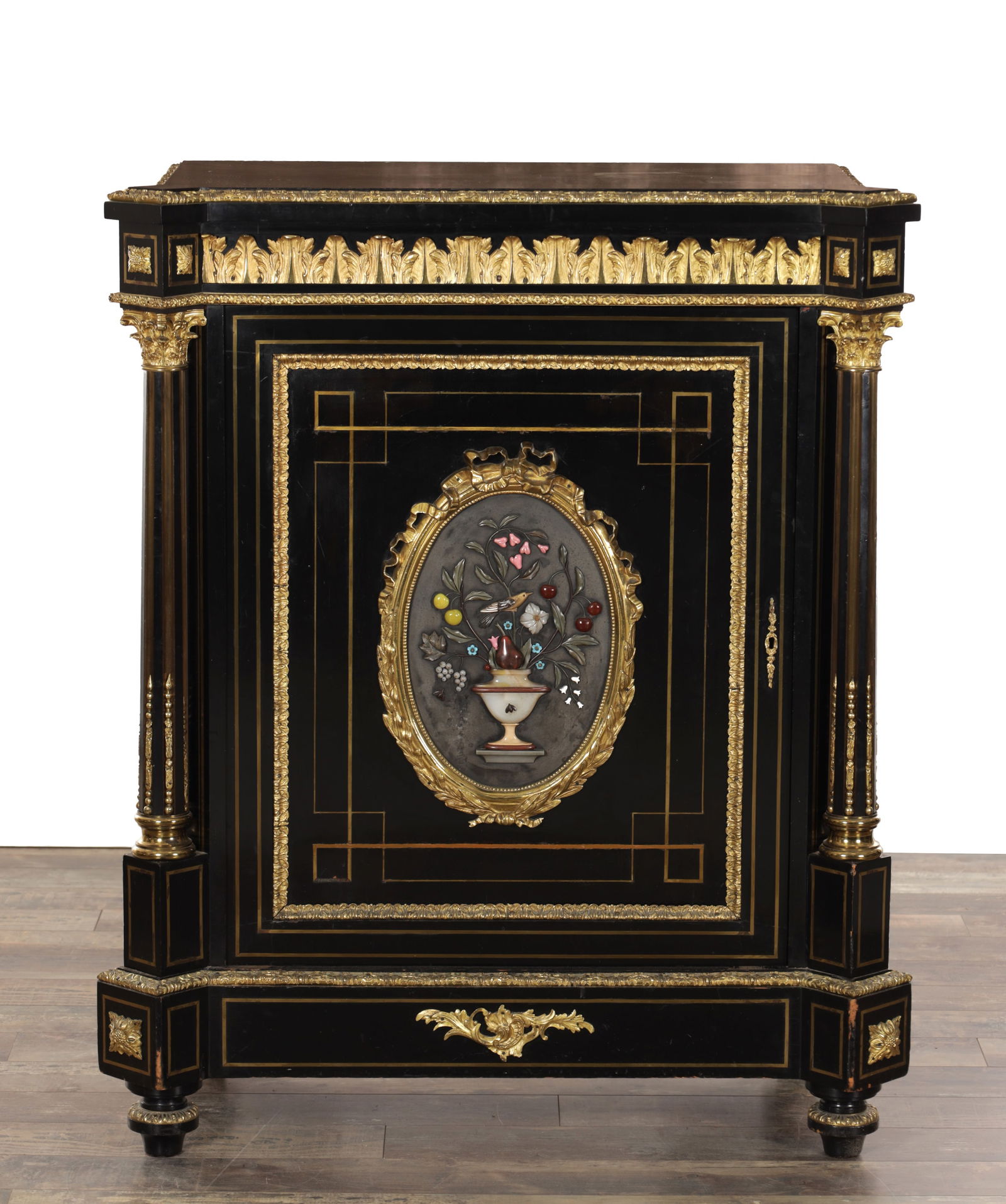 A FINE 19TH CENTURY PIETRA DURA AND ORMOLU MOUNTED EBONISED SIDE CABINET: A FINE 19TH CENTURY PIETRA DURA AND ORMOLU MOUNTED EBONISED SIDE CABINET with a moulded top and acanthus cast frieze above a single panelled door centred by an oval pietra dura still life of flowers i