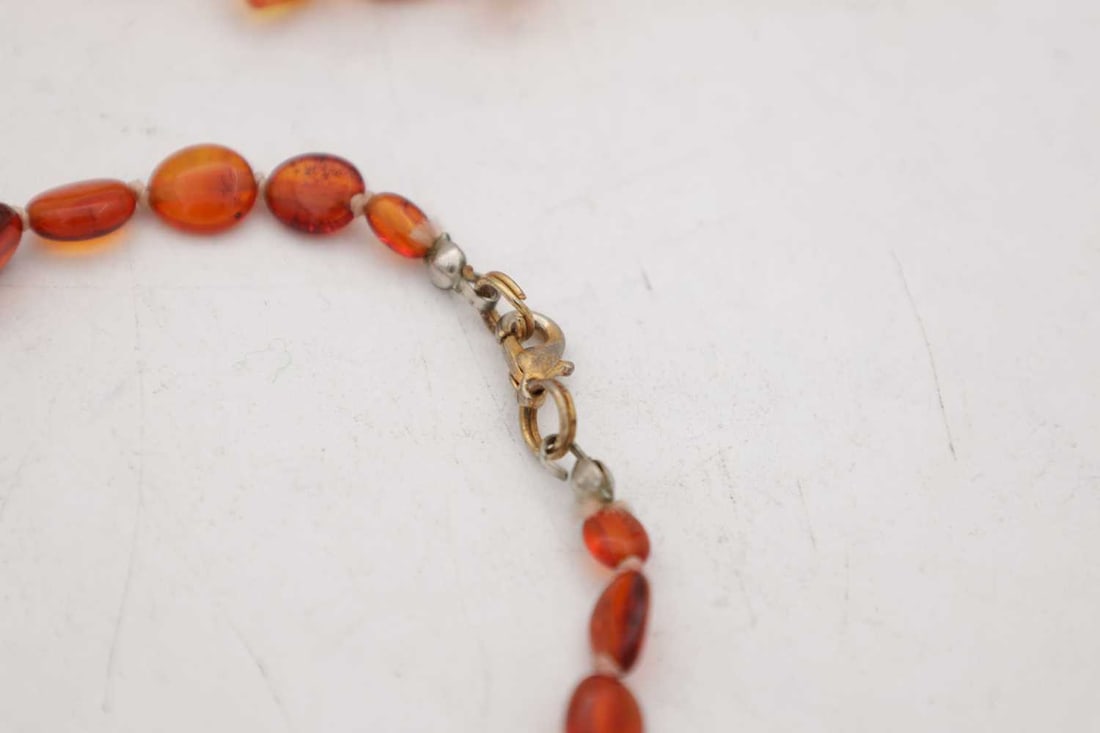 A COLLECTION OF THREE AMBER NECKLACES - 2